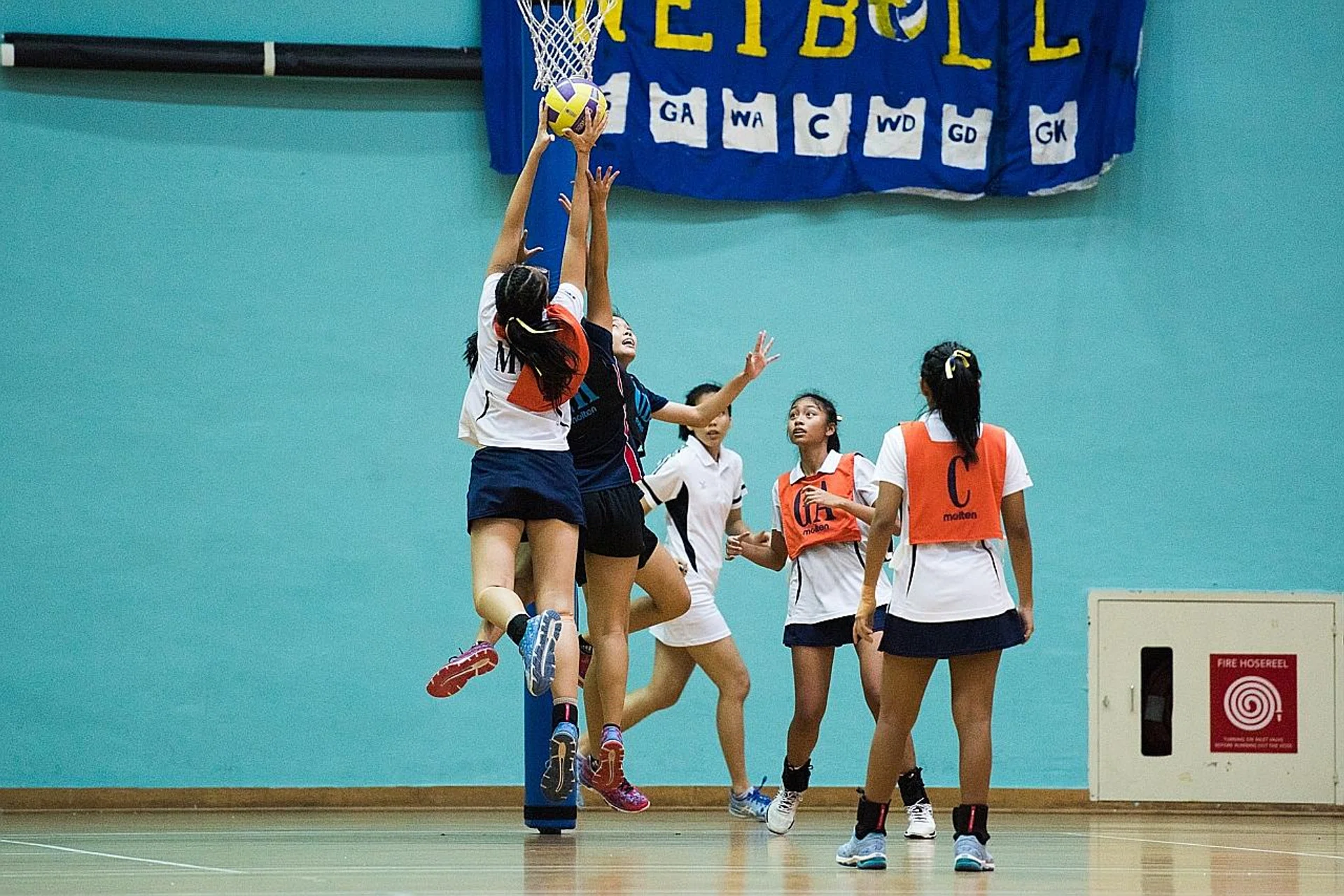 Yu Jiawei (with ball), captain of Methodist Girls' School's B Division team, leading her side to victory over Nan Hua High School in yesterday's Schools West Zone final. TNP PHOTO: LEE JIA WEN