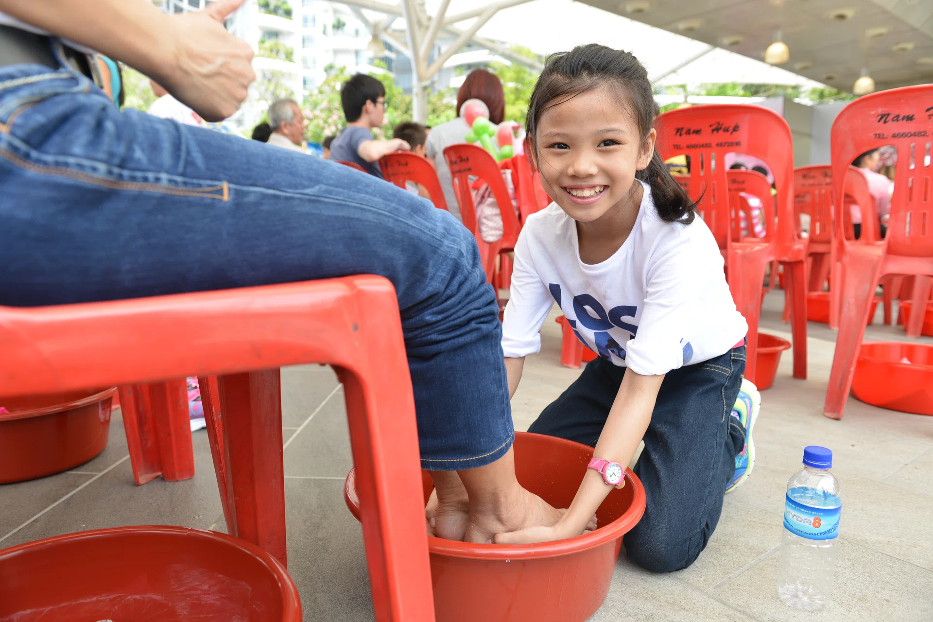 "I felt good washing my mother’s feet and I didn’t feel shy or that it was anything unusual." - Jocelyn Tan