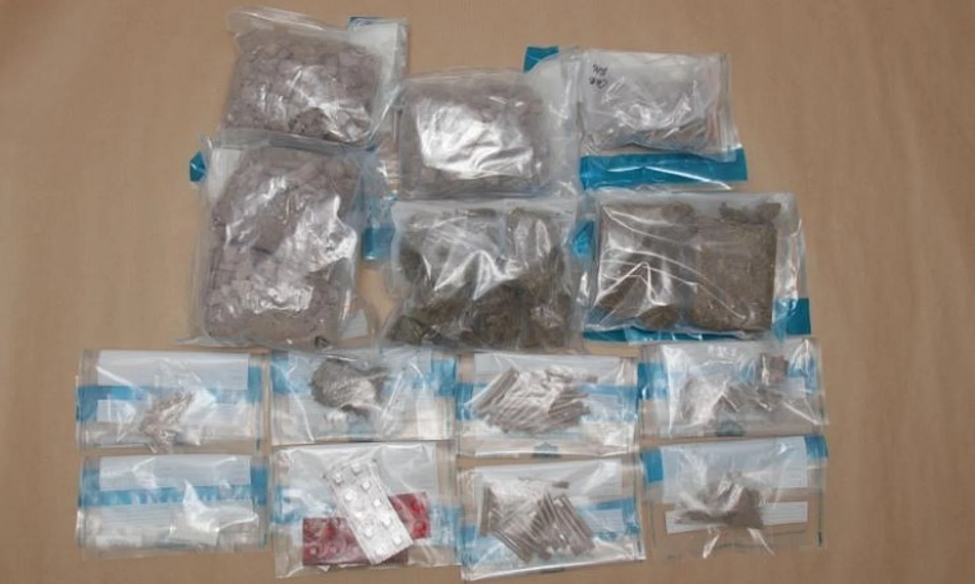 Heroin, cannabis, "Ice", Ecstasy and Erimin-5 tablets were seized from the unit where the man was arrested.