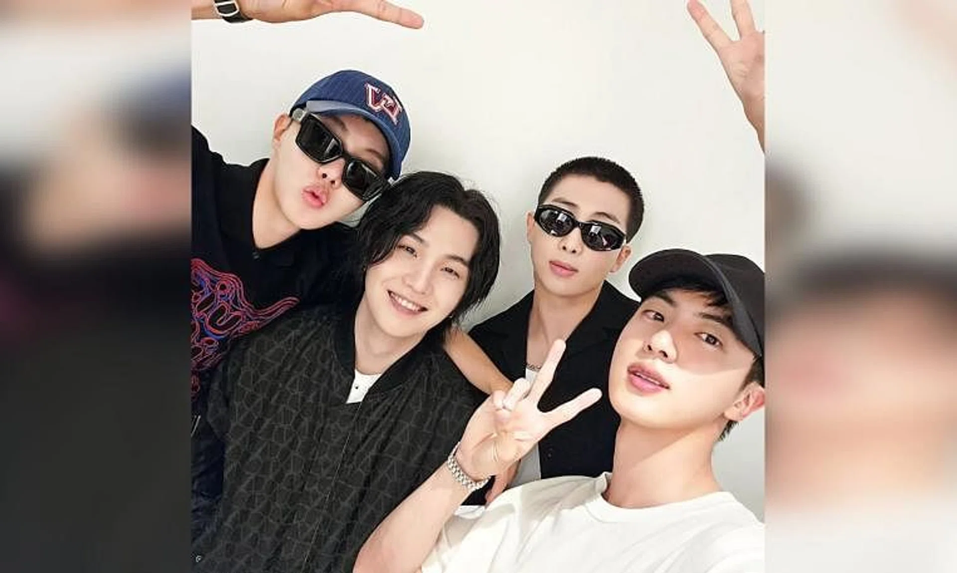 (From left) BTS' J-Hope, Suga, RM and Jin posing for a photo backstage after Suga's final D-Day concert in Seoul.