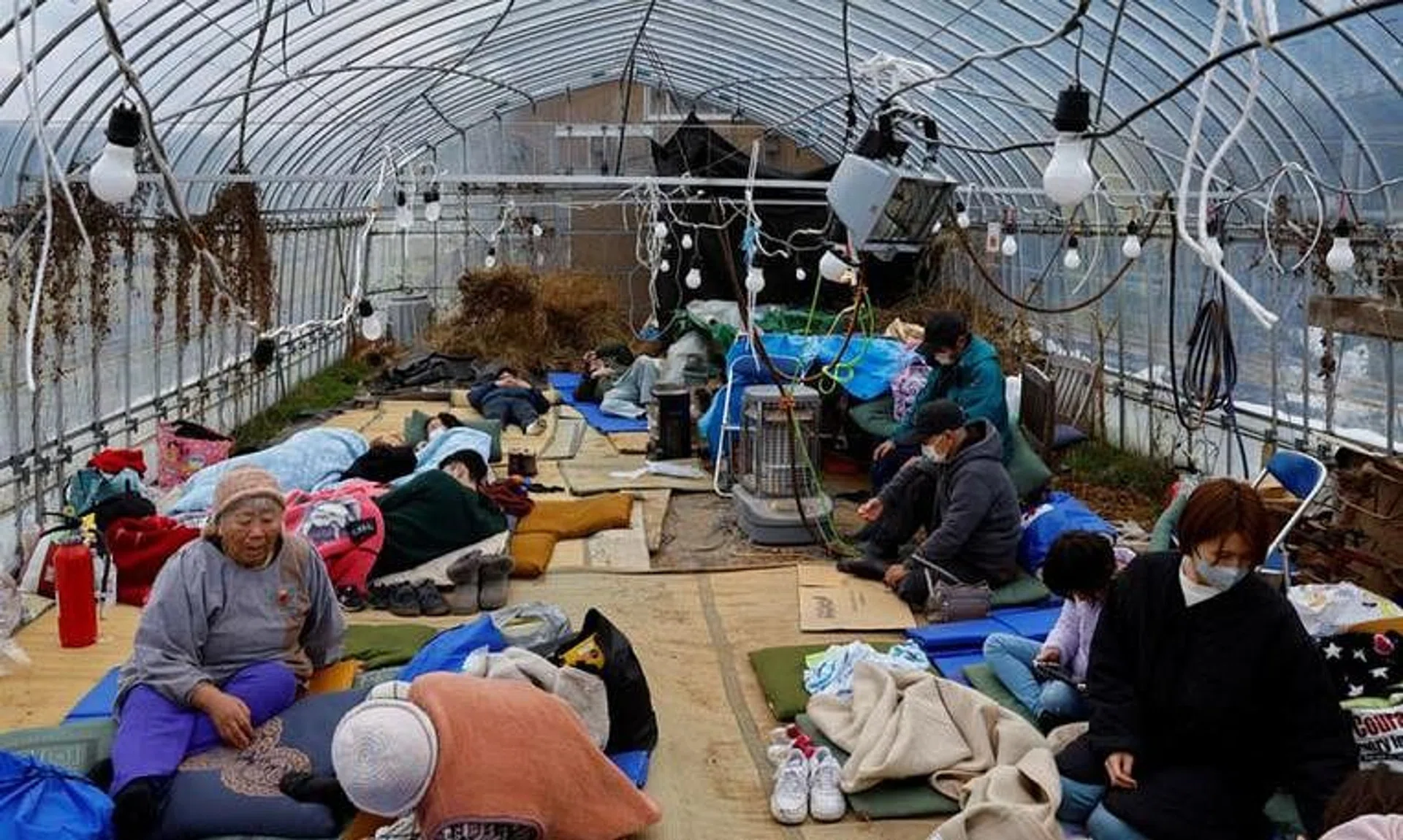Evacuated people rest at a green house converted as an evacuation center, in the aftermath of an earthquake,  in Wajima, Ishikawa prefecture, Japan January 2, 2024, REUTERS/Kim Kyung-Hoon