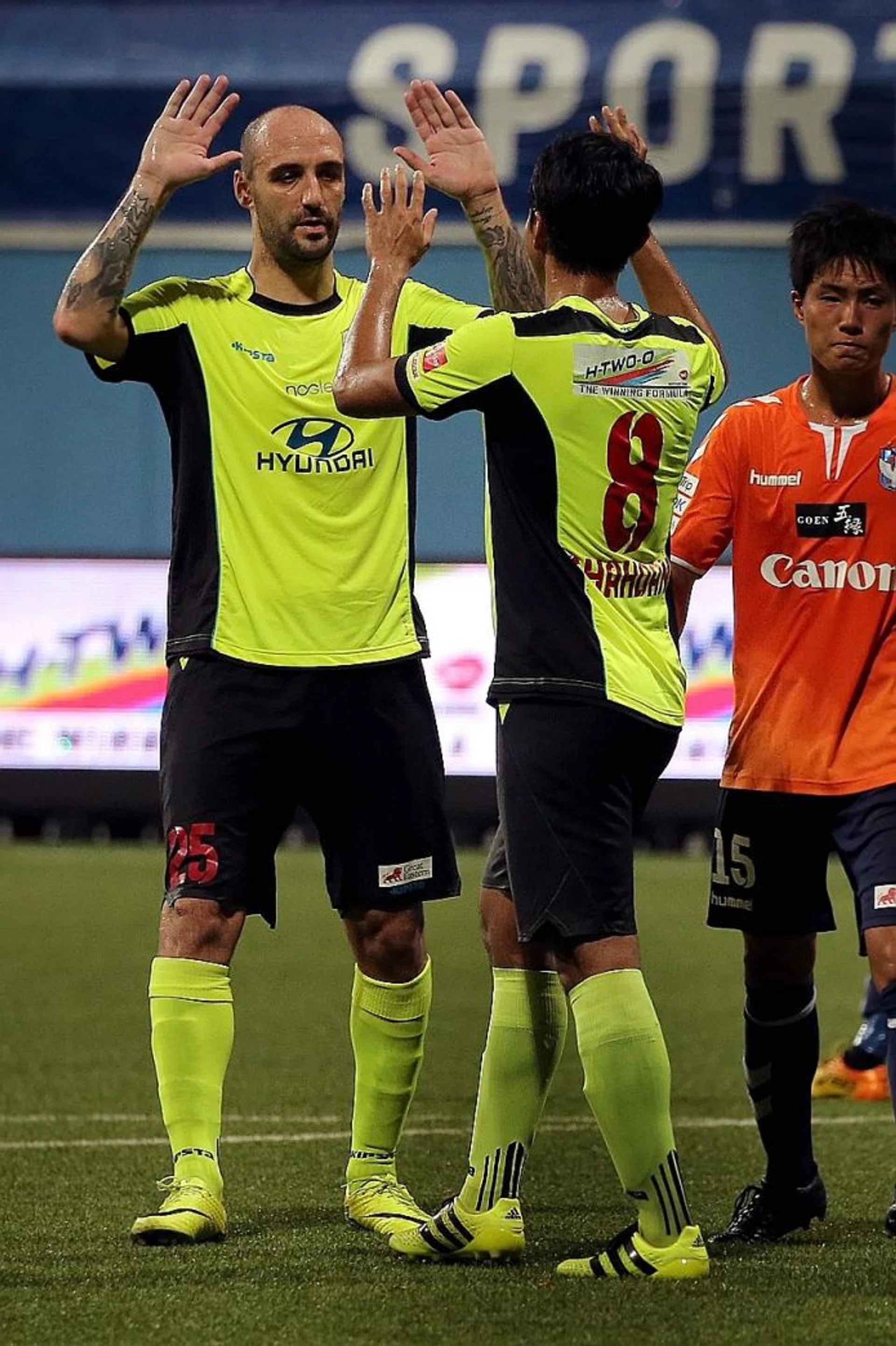 HI-FIVE: Billy Mehmet (above) celebrating with Shahdan Sulaiman as the Stags run riot.