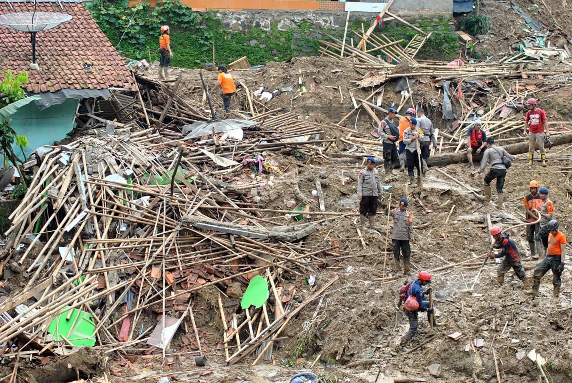 A rescue team looking for victims after landslides hit Bogor, West Java province on Sunday. PHOTO: REUTERS