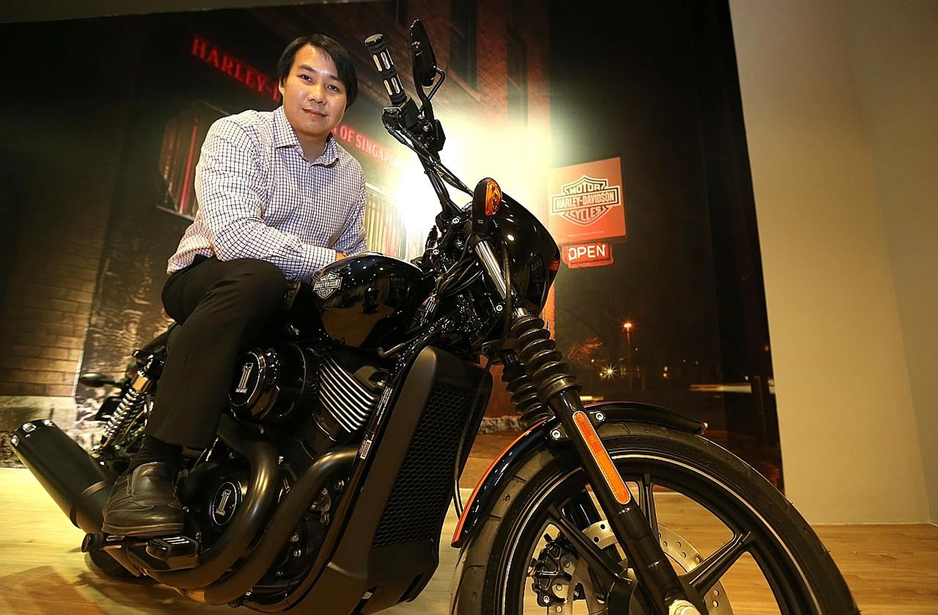 Mr Khoo Jun Wah and his new motorcycle. 