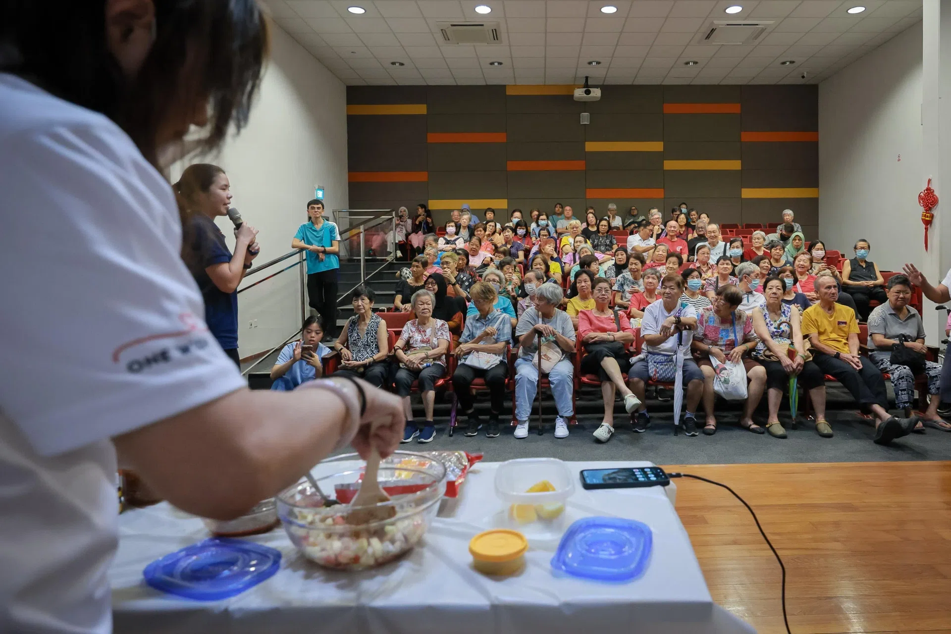 A demonstration on how to make a healthy dressing for salad at the Eat Smart, Age Strong event in Boon Lay Community Centre on Oct 8.