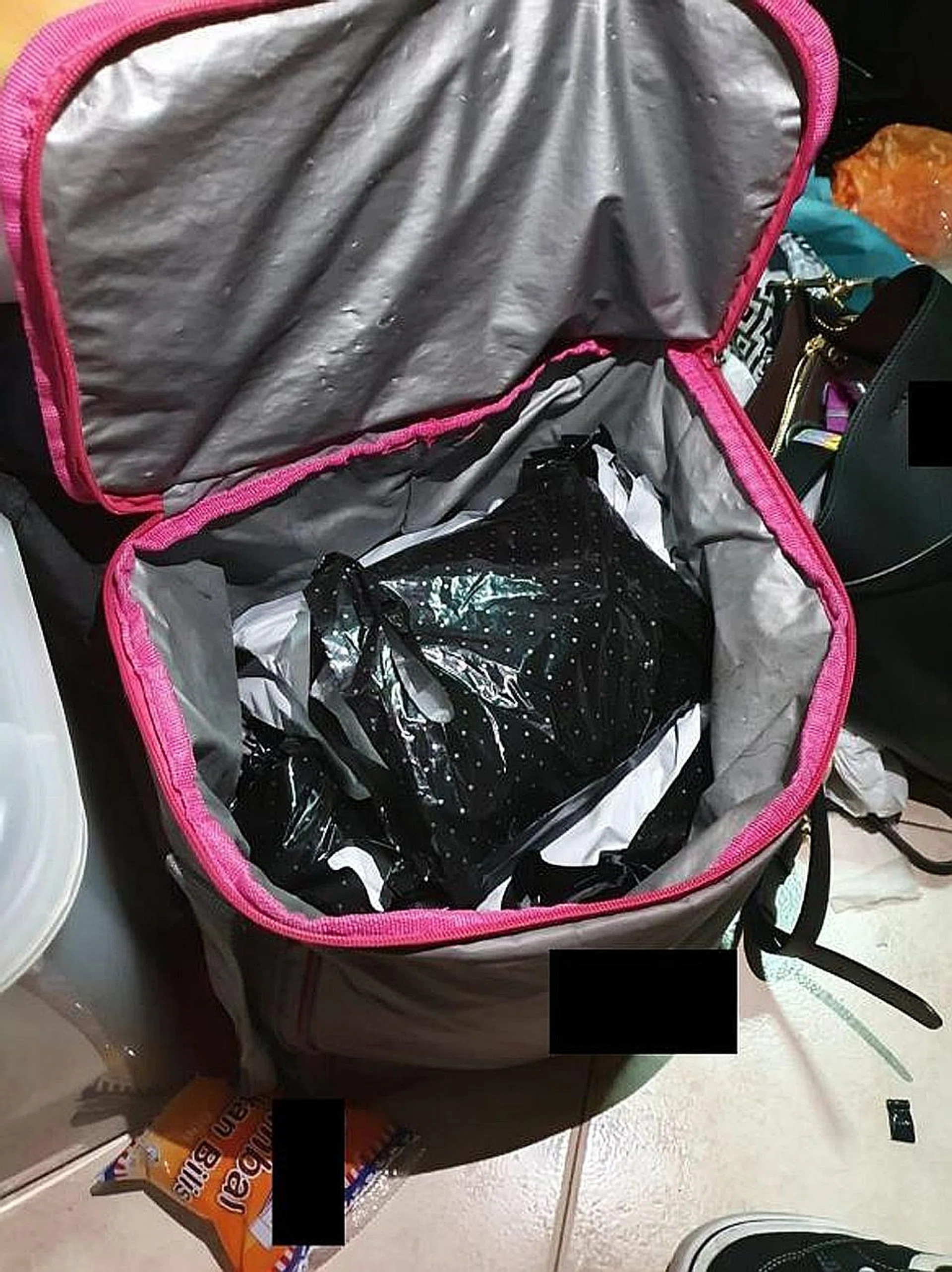 CNB officers found bundles containing heroin, Ice, and cannabis, along with various drug paraphernalia, packets of contraband cigarettes, and cash amounting to $5,895 from a unit in Bukit Batok on Tuesday.