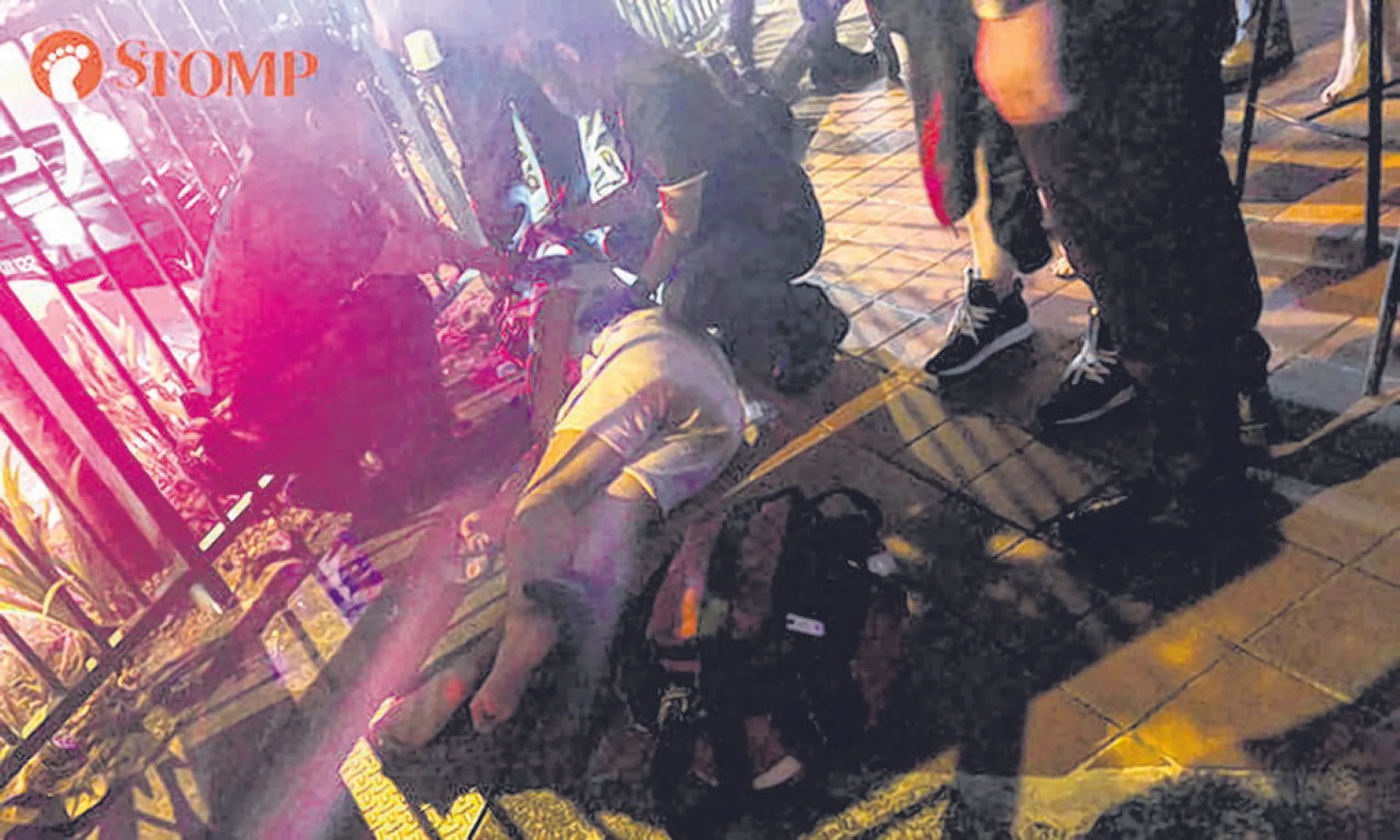 A witness said a group of attackers pounced on Mr Gary Gan, knocked him to the ground and repeatedly kicked his head for five minutes. 