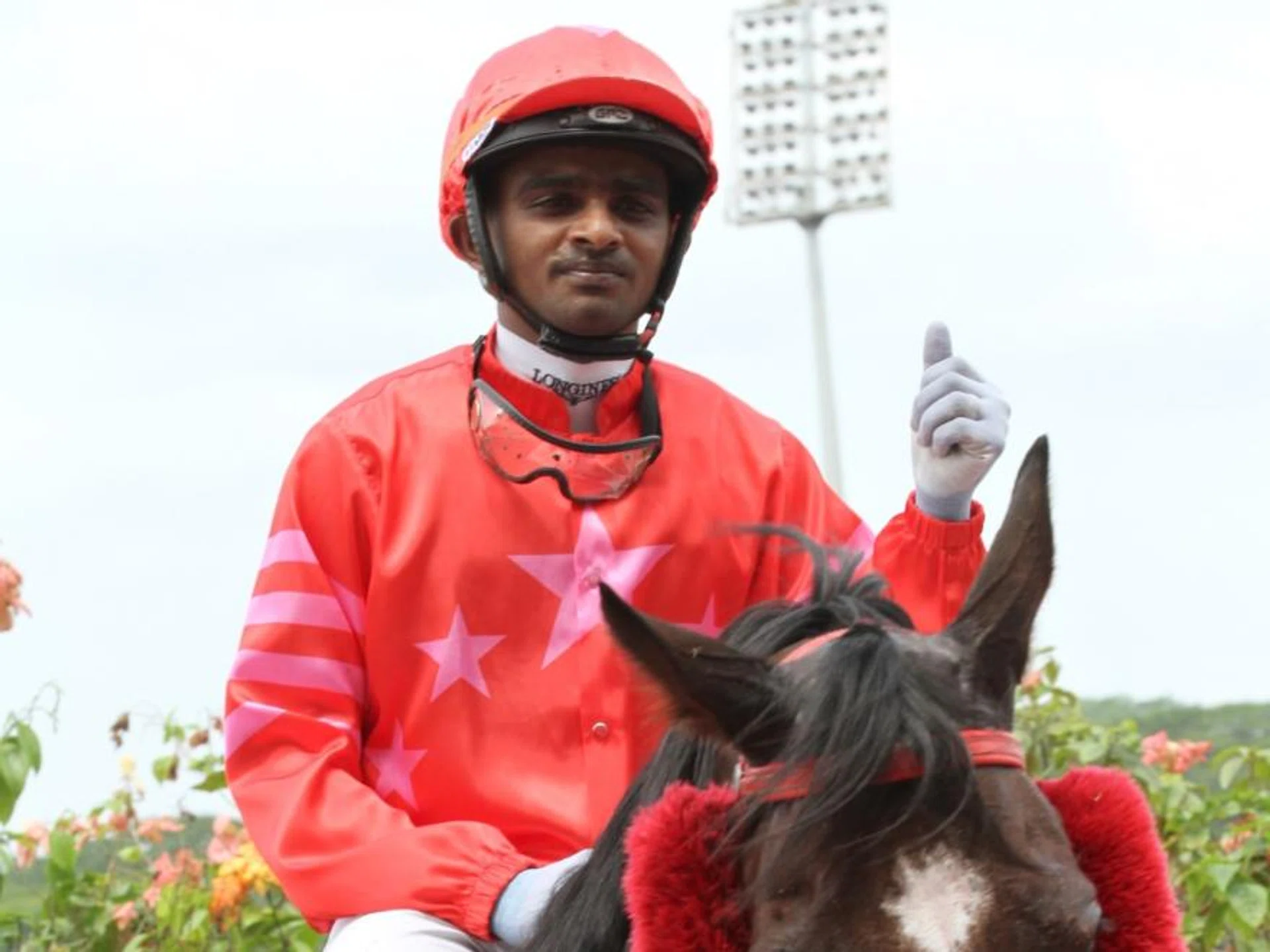 Krisna Thangamani may not be the most exuberant jockey at the winner's box, but he has clearly forged a strong bond with Sacred Buddy.
