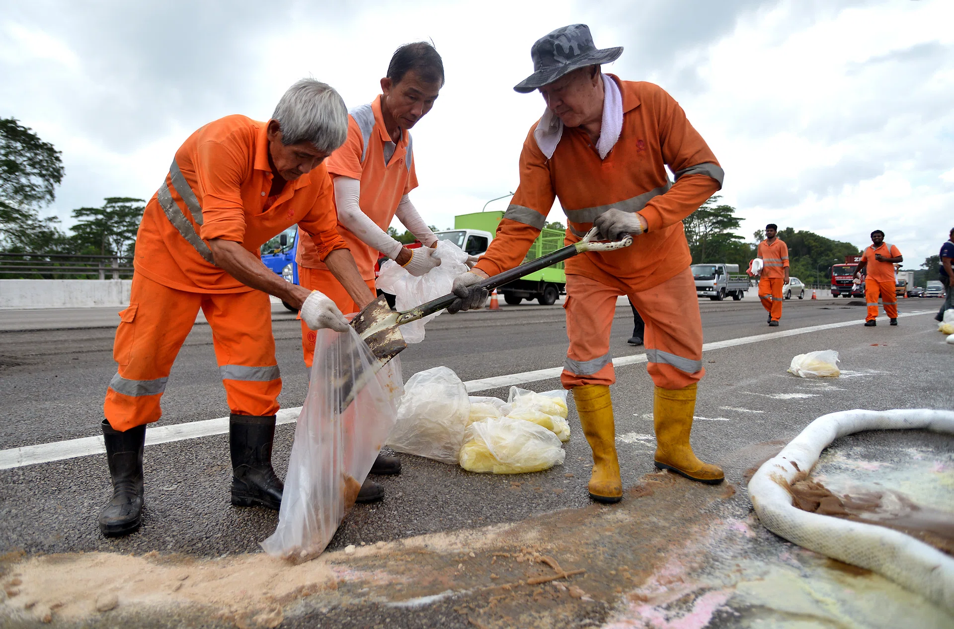 SPILL: After an oil tanker was damaged in an accident, its leakage of palm oil caused a massive traffic jam and part of the Bukit Timah Expressway had to be resurfaced. 
