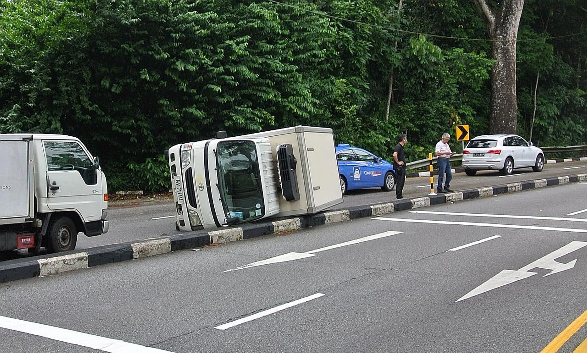 The overturned truck at Eng Neo Avenue. 