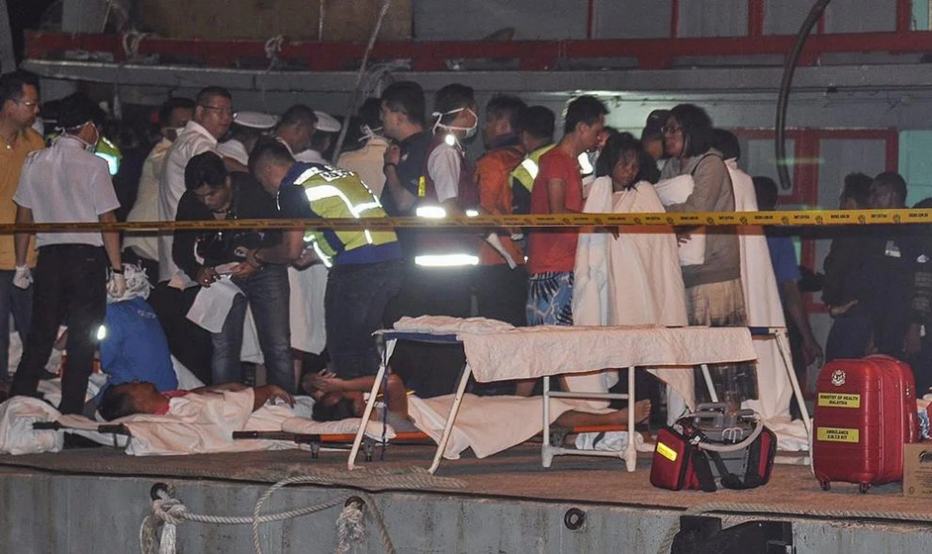 Survivors of a sunken tourist Catamaran receive medical assistance at the Malaysia Marine Operation Force post in Kota Kinabalu, Sabah, Malaysia.