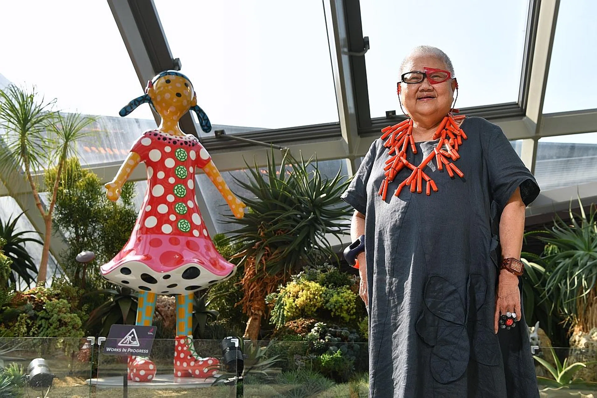 Ms Lee Tuan with Kei-Chan, a 2.6m-tall sculpture by renowned Japanese artist Yayoi Kusama. 