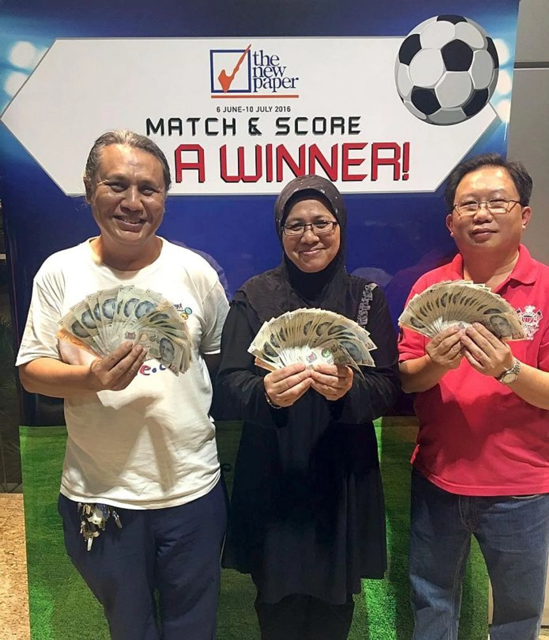 JACKPOT WINNERS: (From left) Mr Mohammad Yunus Karim, Madam Sarifah Abdullah and Mr Ong Hwee Hong.