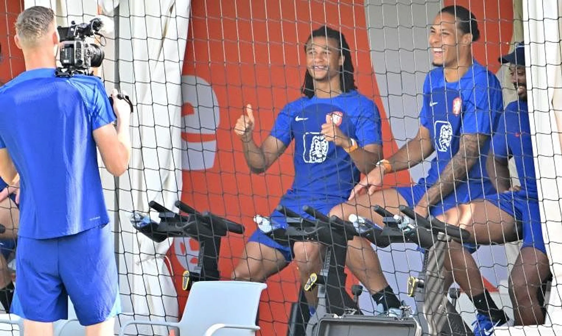 Netherlands' goalkeeper Andries Noppert "filming" teammates Nathan Ake and Virgil van Dijk during a training session on Dec 4.