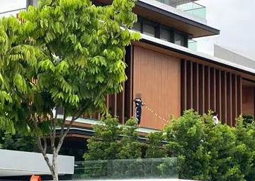 Is this safe?: Photo of two women seen standing on roof ledge of house sparks concern
