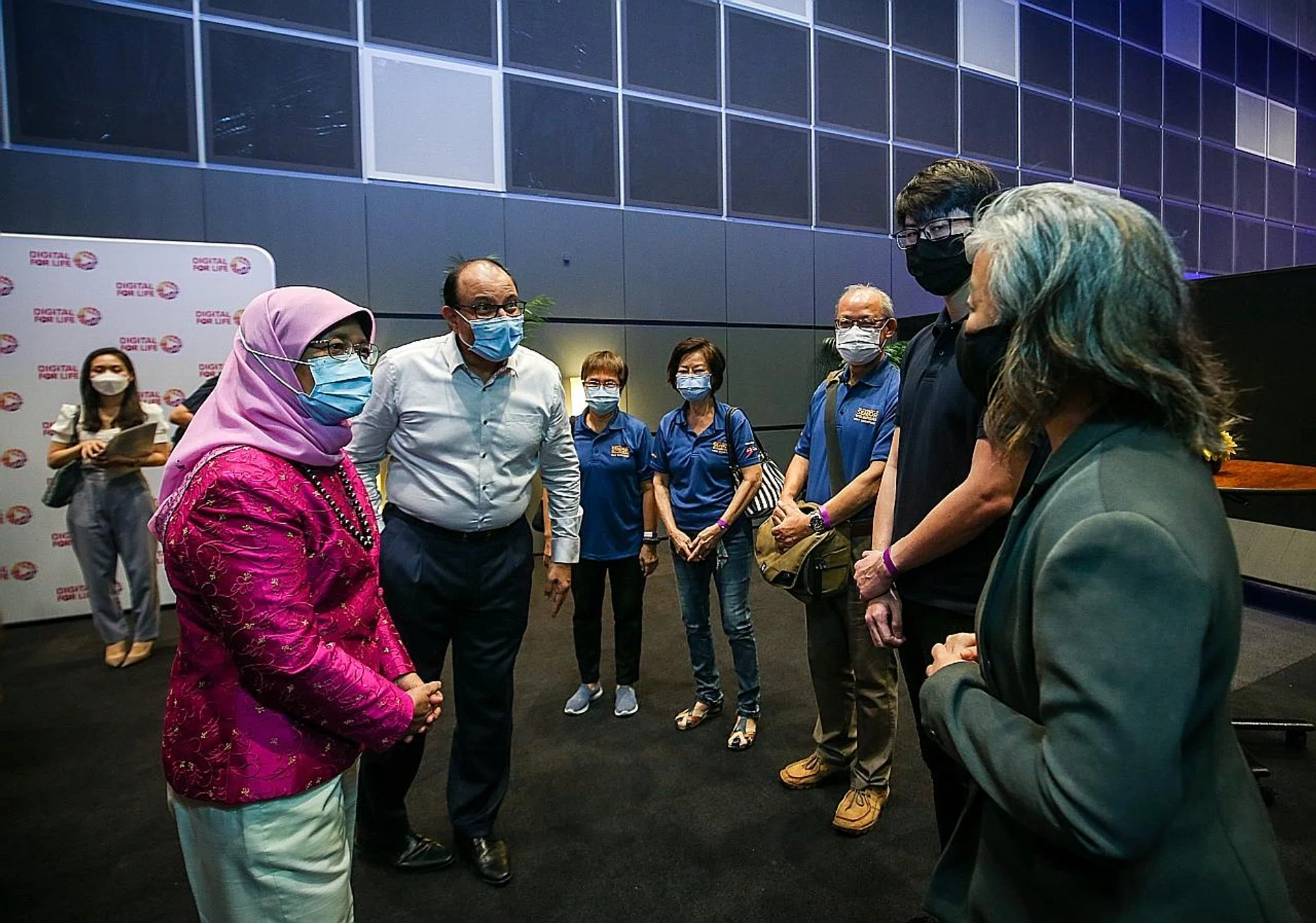President Halimah Yacob and Mr S. Iswaran at the Infocomm Media Development Authority's partners' appreciation event yesterday to recognise those who contributed to digital inclusion and readiness efforts here in 2019 and last year. 