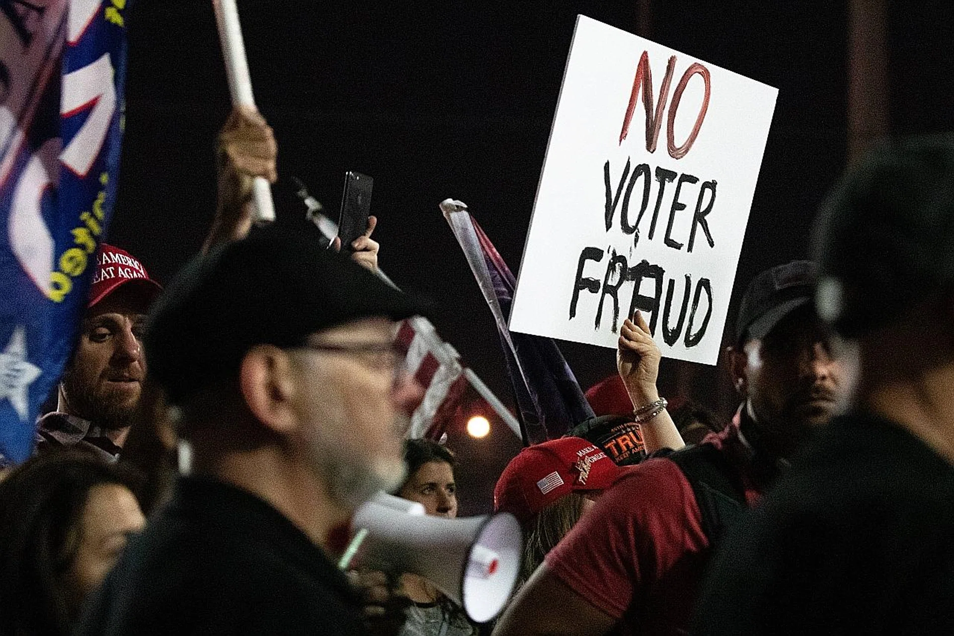 Protesters in front of the Maricopa County Elections Department in Phoenix on Wednesday night. Rumours had spread that some Maricopa votes were not being counted because voters used Sharpie pens to mark their ballots. 