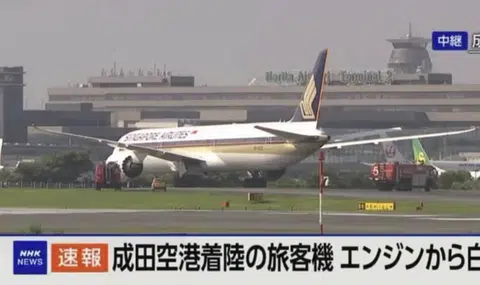 SQ638 lands at Narita Airport in Tokyo with smoky engine