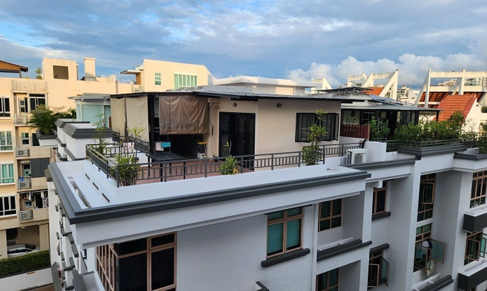 One of the structures in question, at the four-storey Rose Maison, appears to be a glass-enclosed space with an extended roof sheltering part of the terrace.