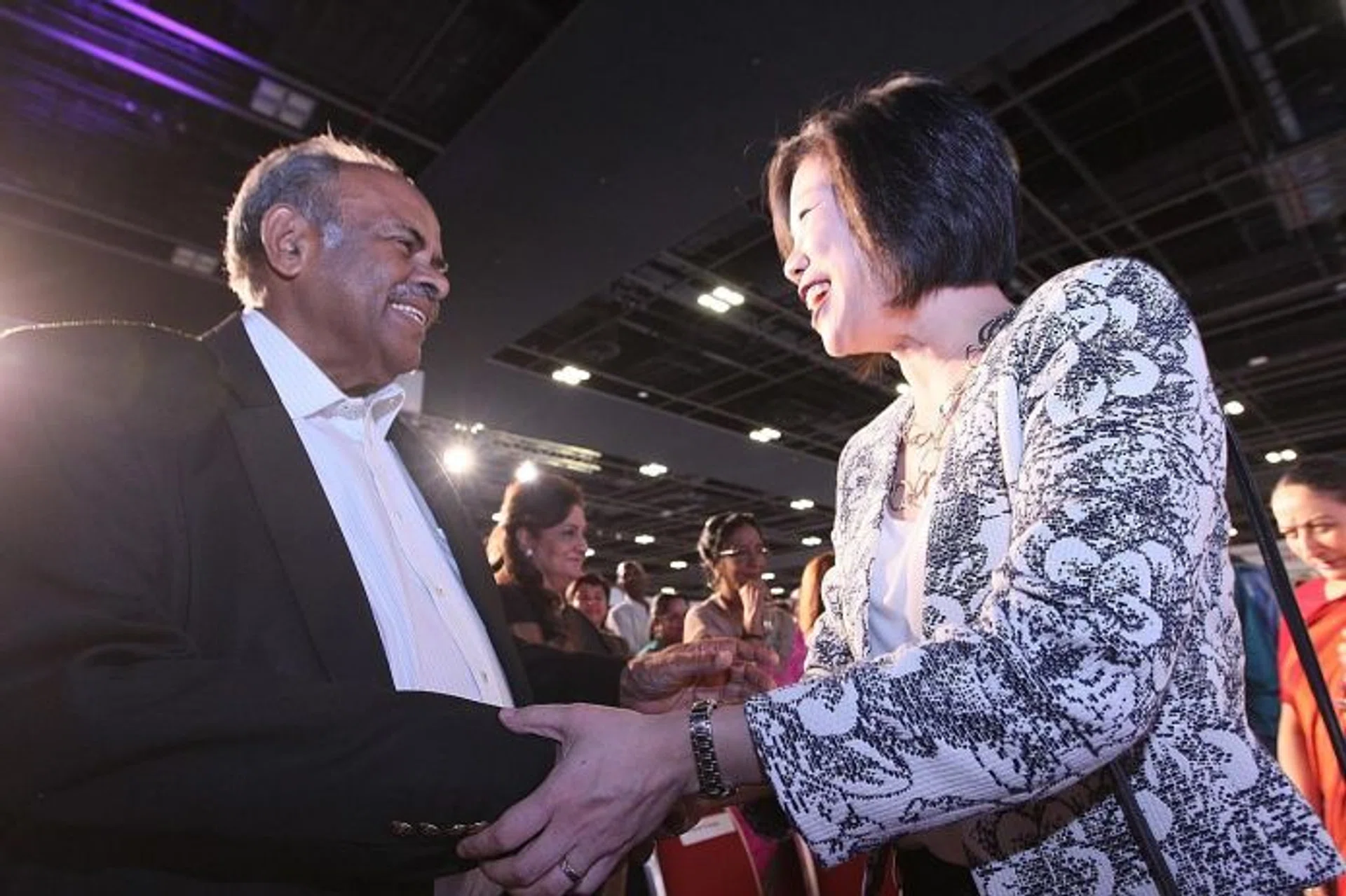 DEDICATED: The 2016 winner of the annual tabla! Community Champion Award, Mr K Kesavapany (left), with Ms Sim Ann (right). 