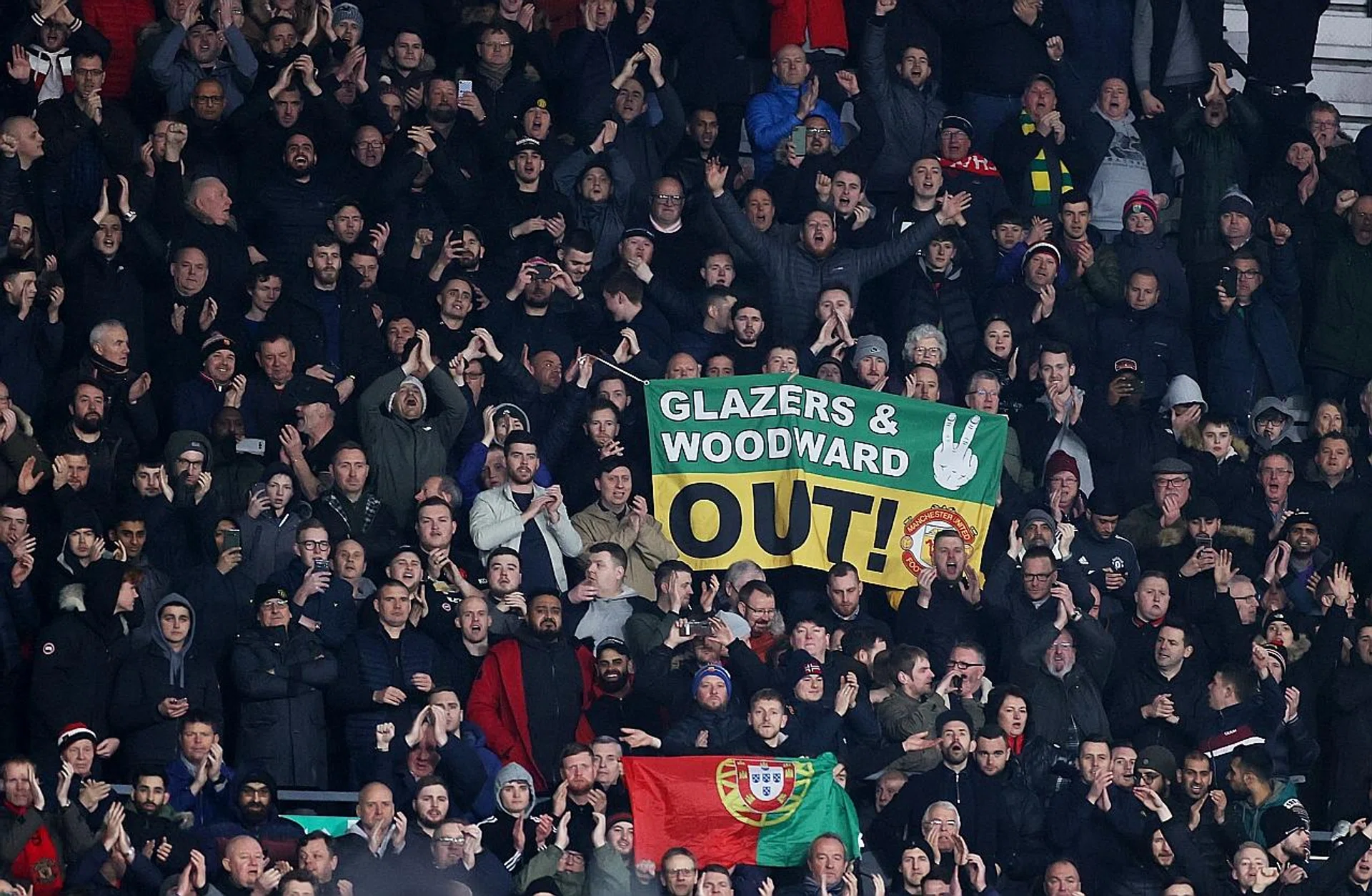 Manchester United fans making their feeling about their CEO Ed Woodward be known during games at Old Trafford. 