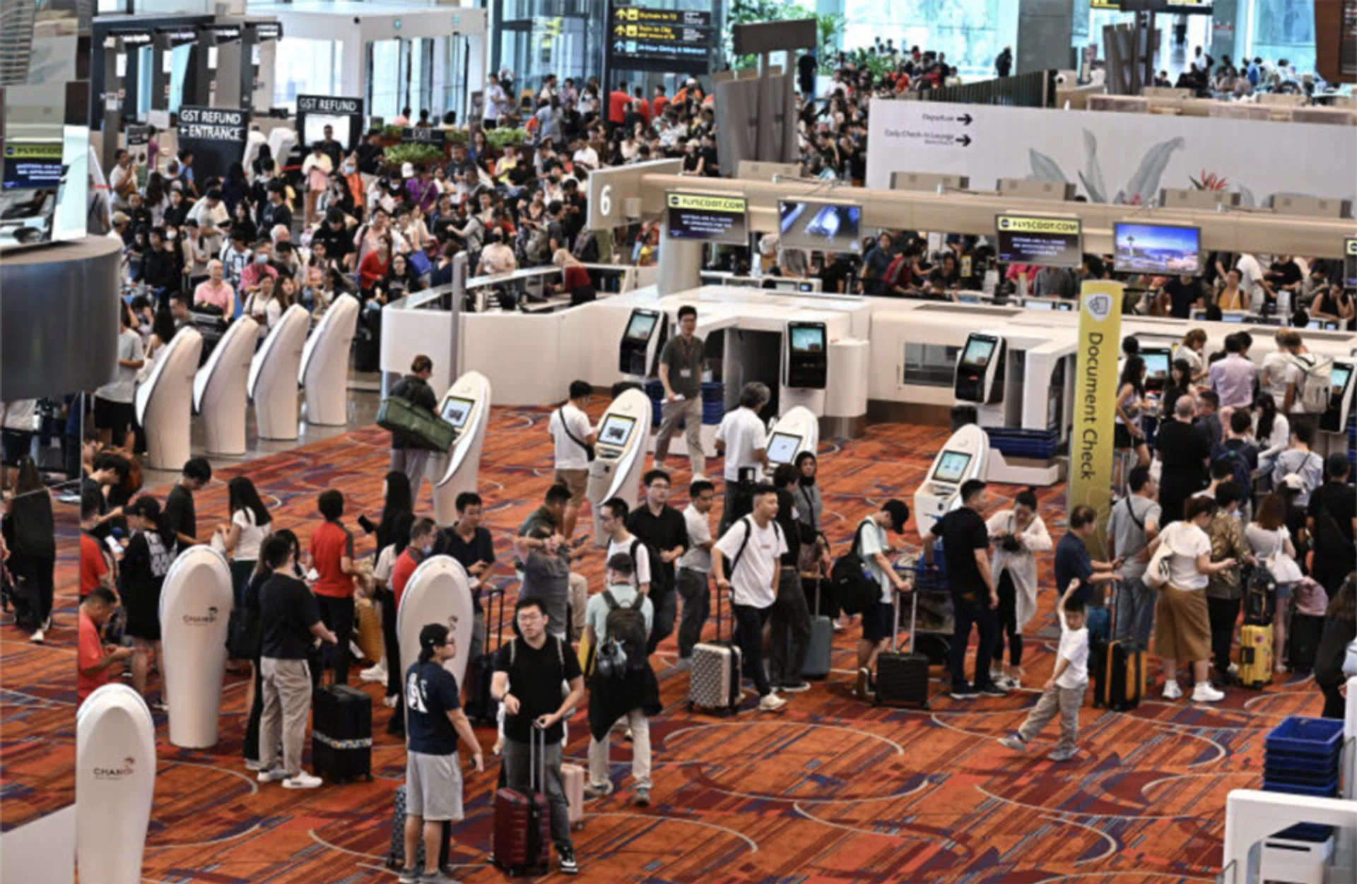 Passengers queueing for the Scoot checkin counters at Changi Airport Terminal 1.