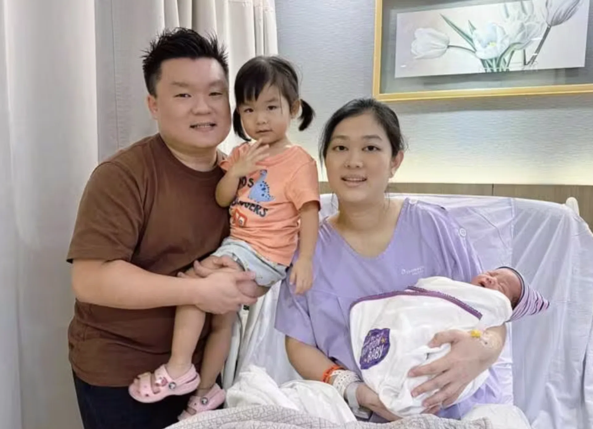 Mr Liu Yongfeng and his wife Zhang Huixian with their children, both born on National Day.