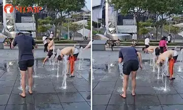 Men wash 'armpits and butts' at water fountain outside National Stadium