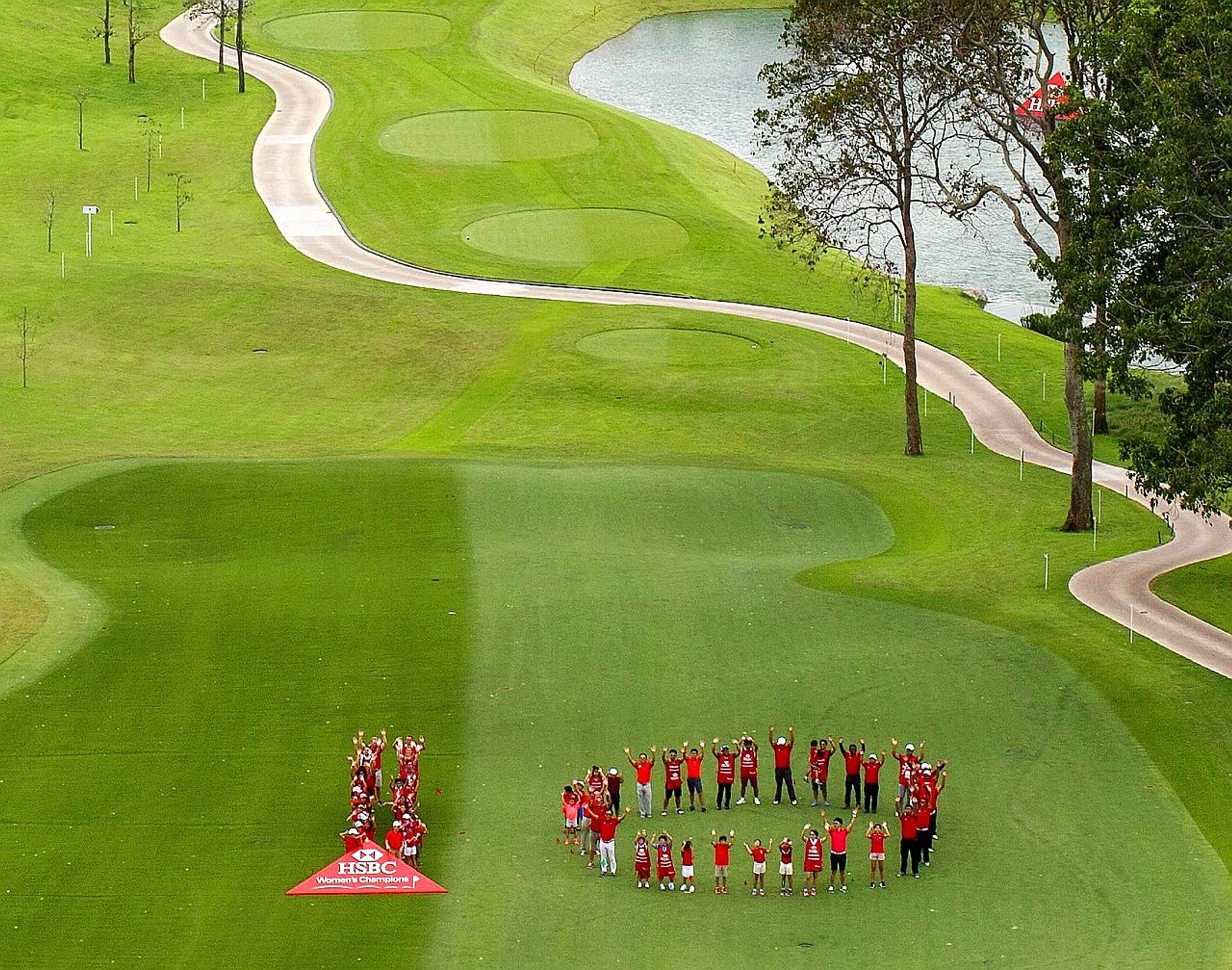 Junior golfers and volunteers forming the number 10 on Sunday to mark the anniversary of the HSBC Women's Champions tournament.
