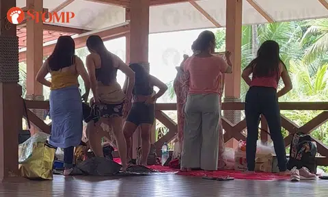 Women change clothes in front of men and kids at St John's Island