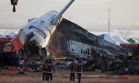 Why is there a concrete wall near the end of Muan Airport runway?