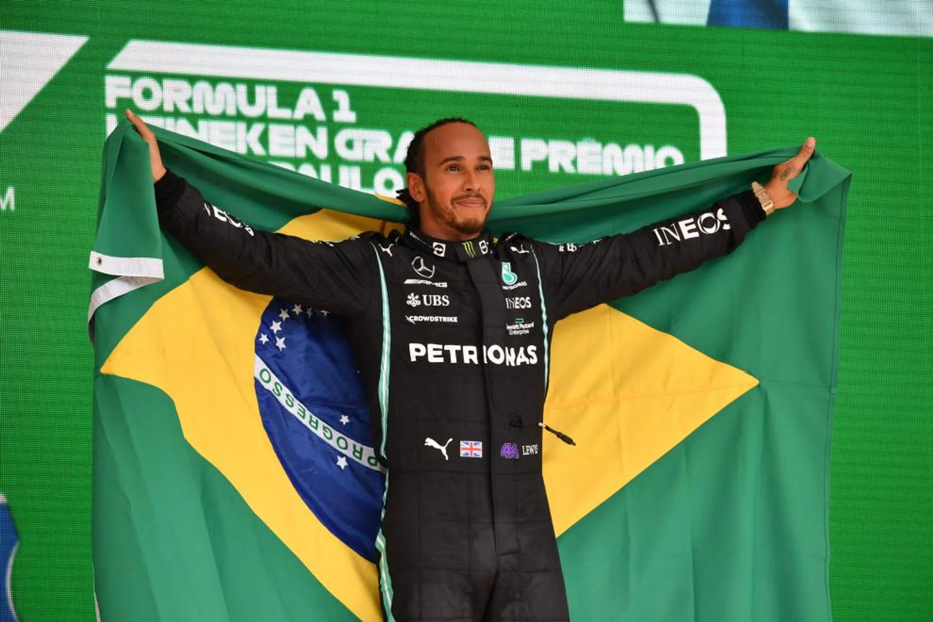Lewis Hamilton celebrates his win in Sao Paulo with a Brazil flag. 