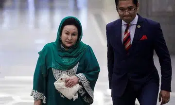 Ex-M'sian PM's wife seeks release of passport to visit daughter in S'pore