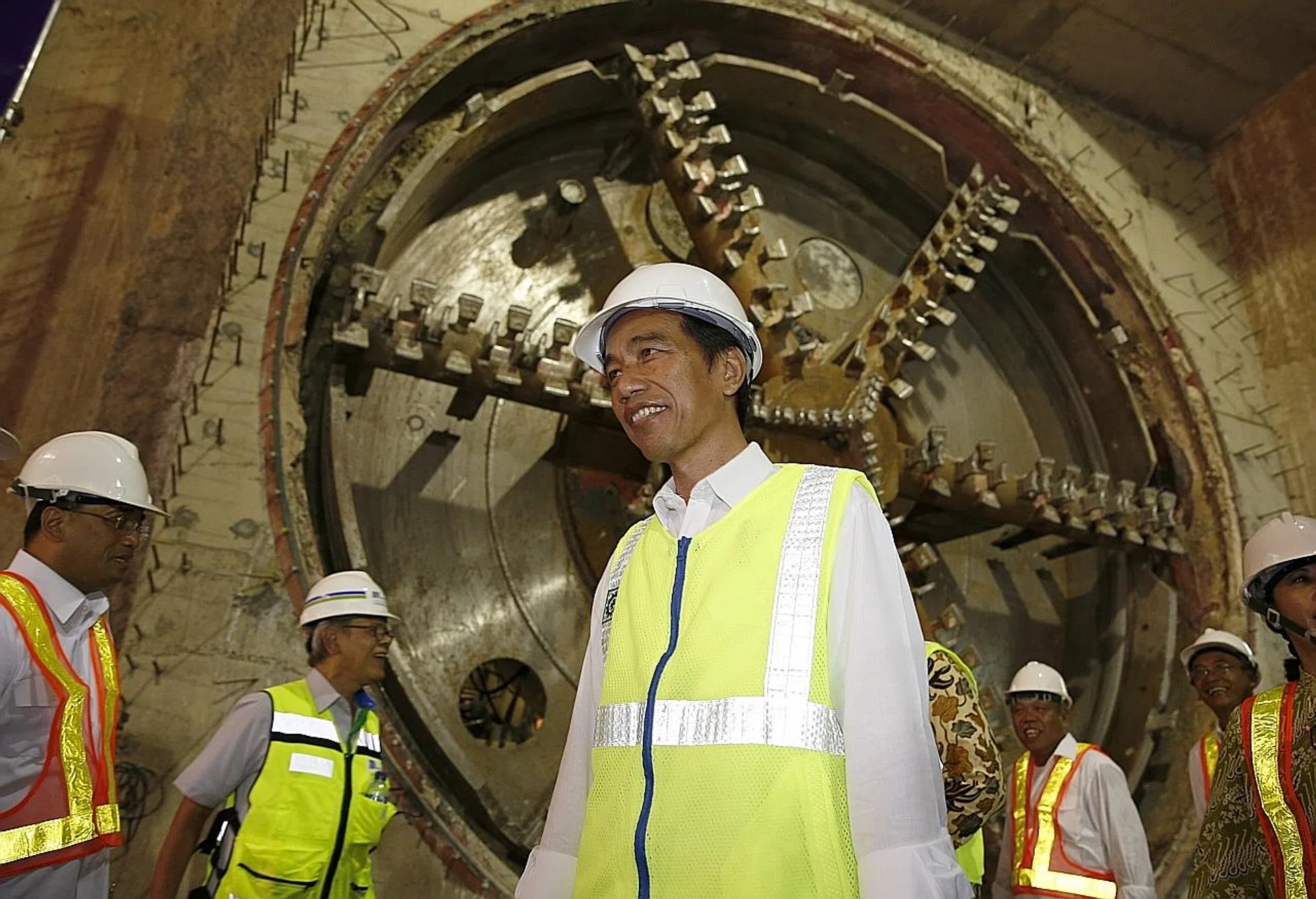 Indonesian President Joko Widodo (centre) inspecting the inside of a tunnel that is part of a mass rapid transportation project in Jakarta yesterday.