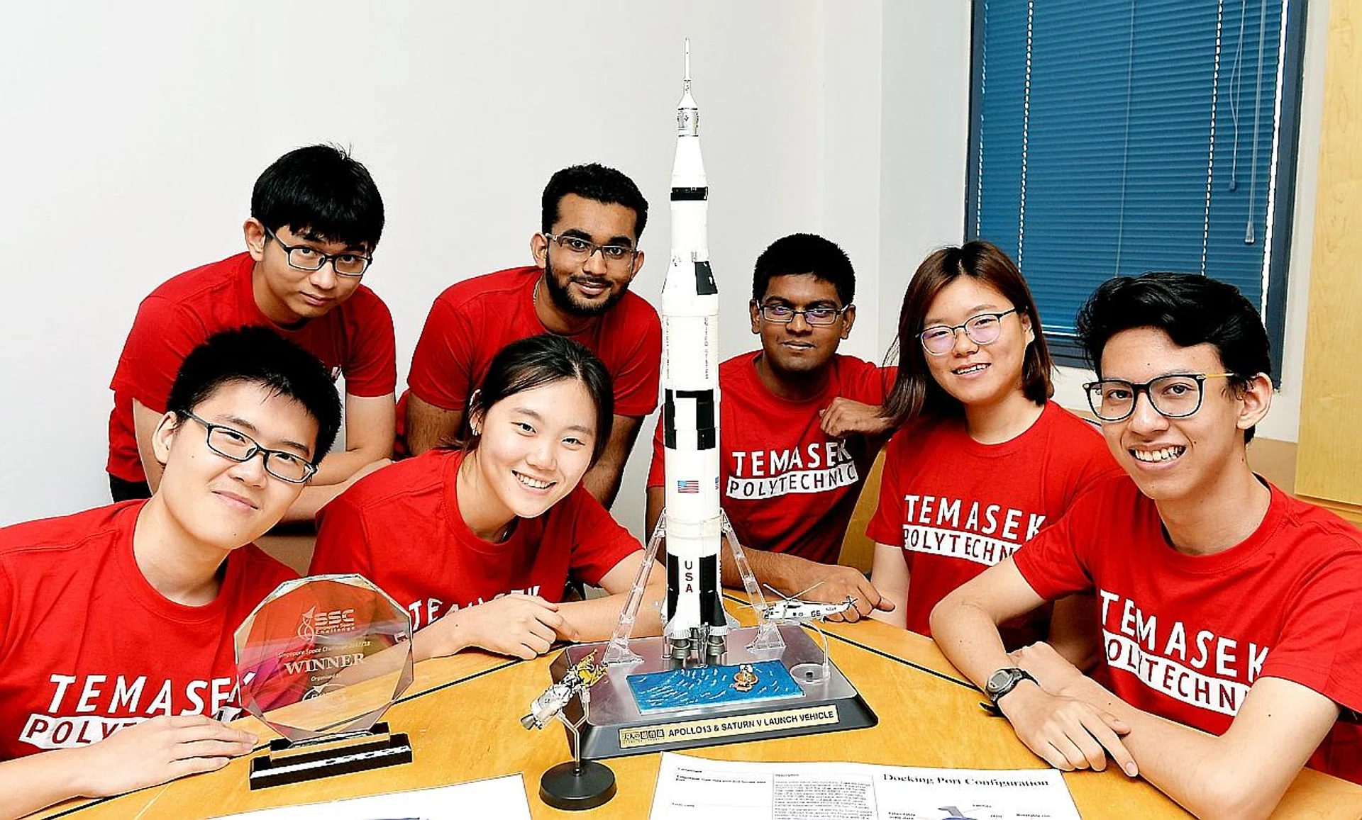 Temasek Polytechnic's Mercury Seven donated part of their winnings to the school. TNP PHOTO: KHALID BABA