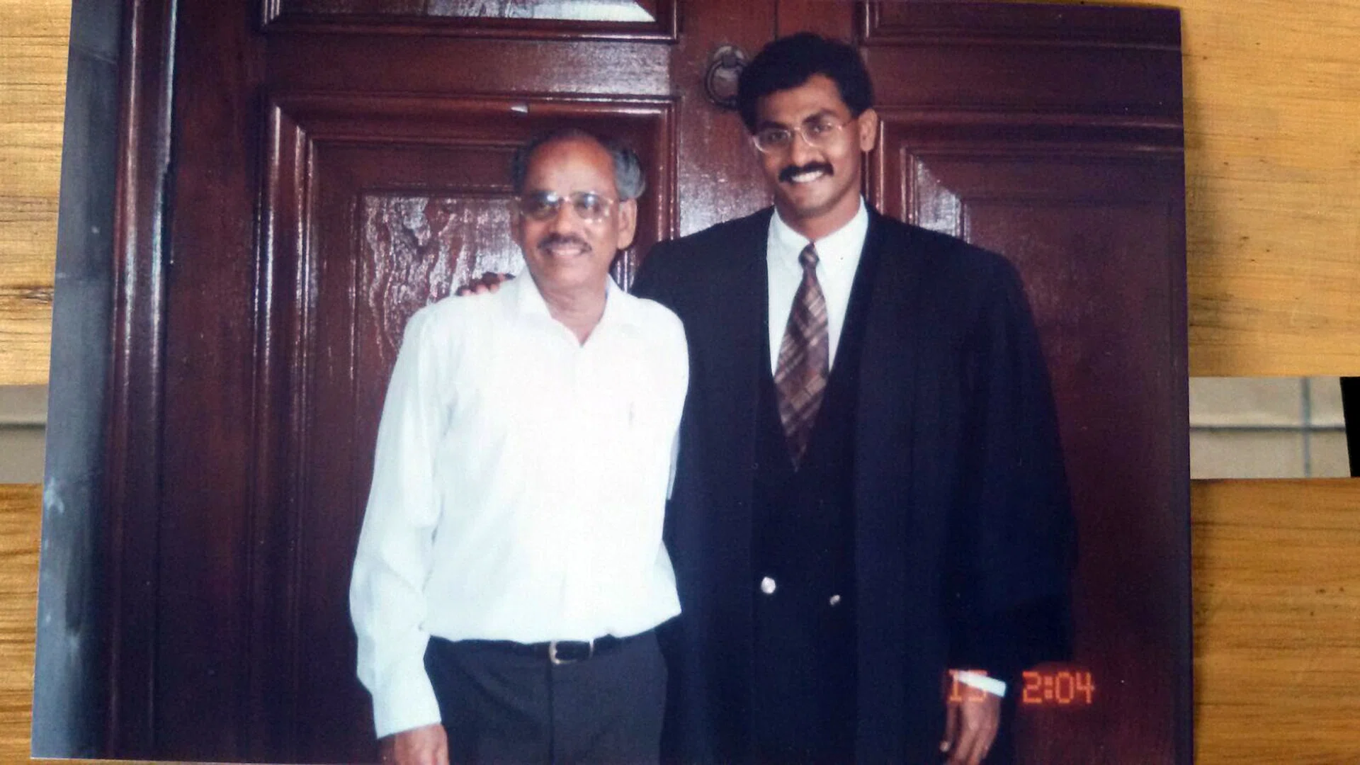 INSPIRED: Mr Muralidharan Pillai with his father P.K. Pillai in a 1996 photo (above).