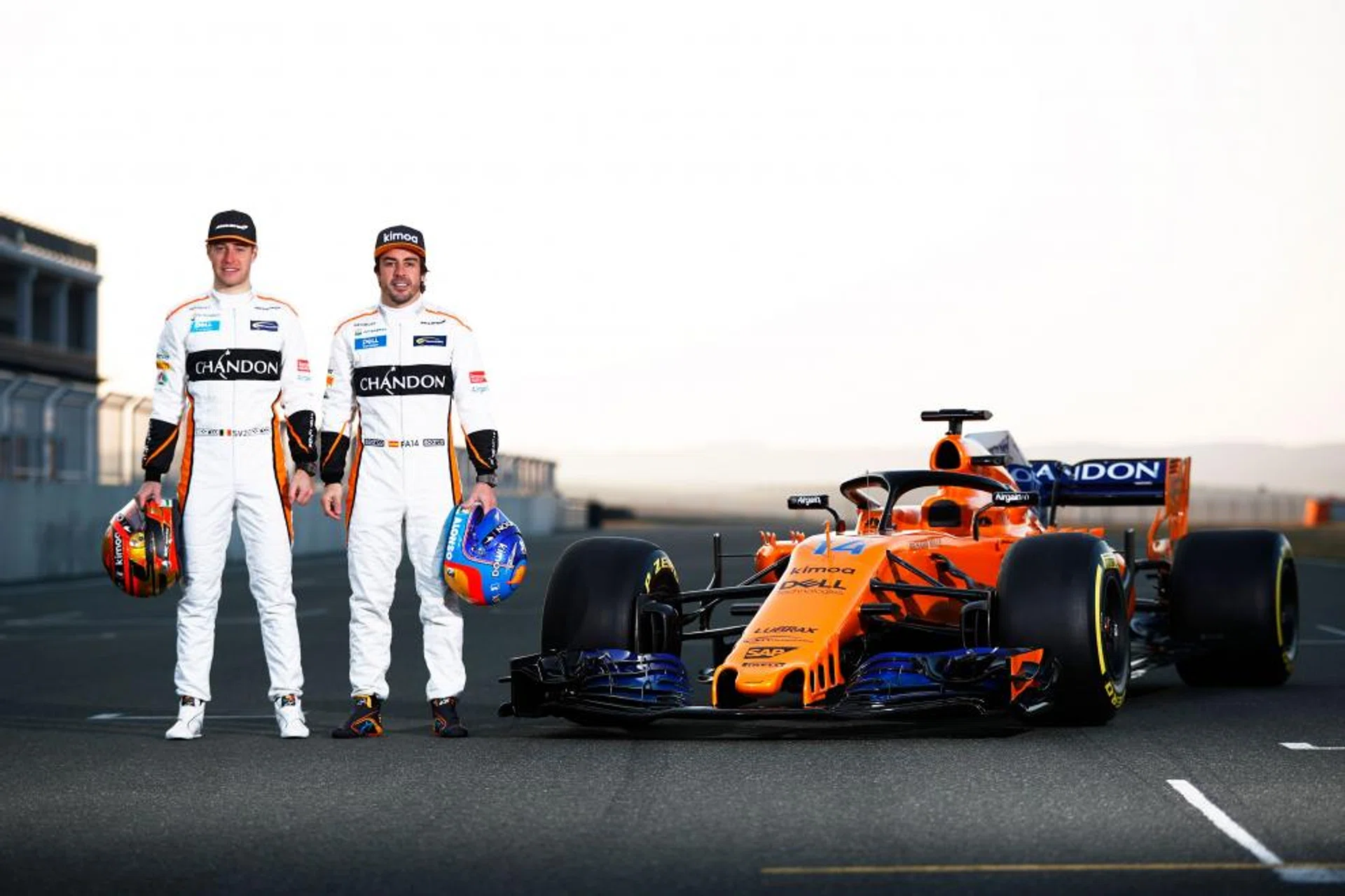 McLaren's Belgian driver Stoffel Vandoorne (left) and Spanish driver Fernando Alonso posing by their MCL33 car.