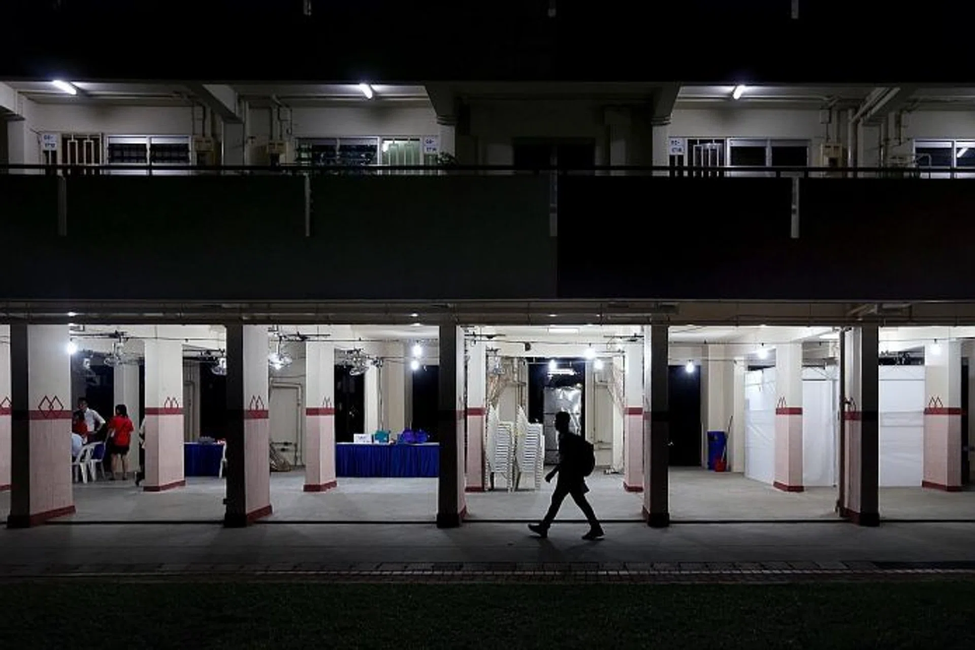FOR RESIDENTS: A screening area being set up yesterday at Block 203, Ang Mo Kio Avenue 3. It will be open today from 9am.