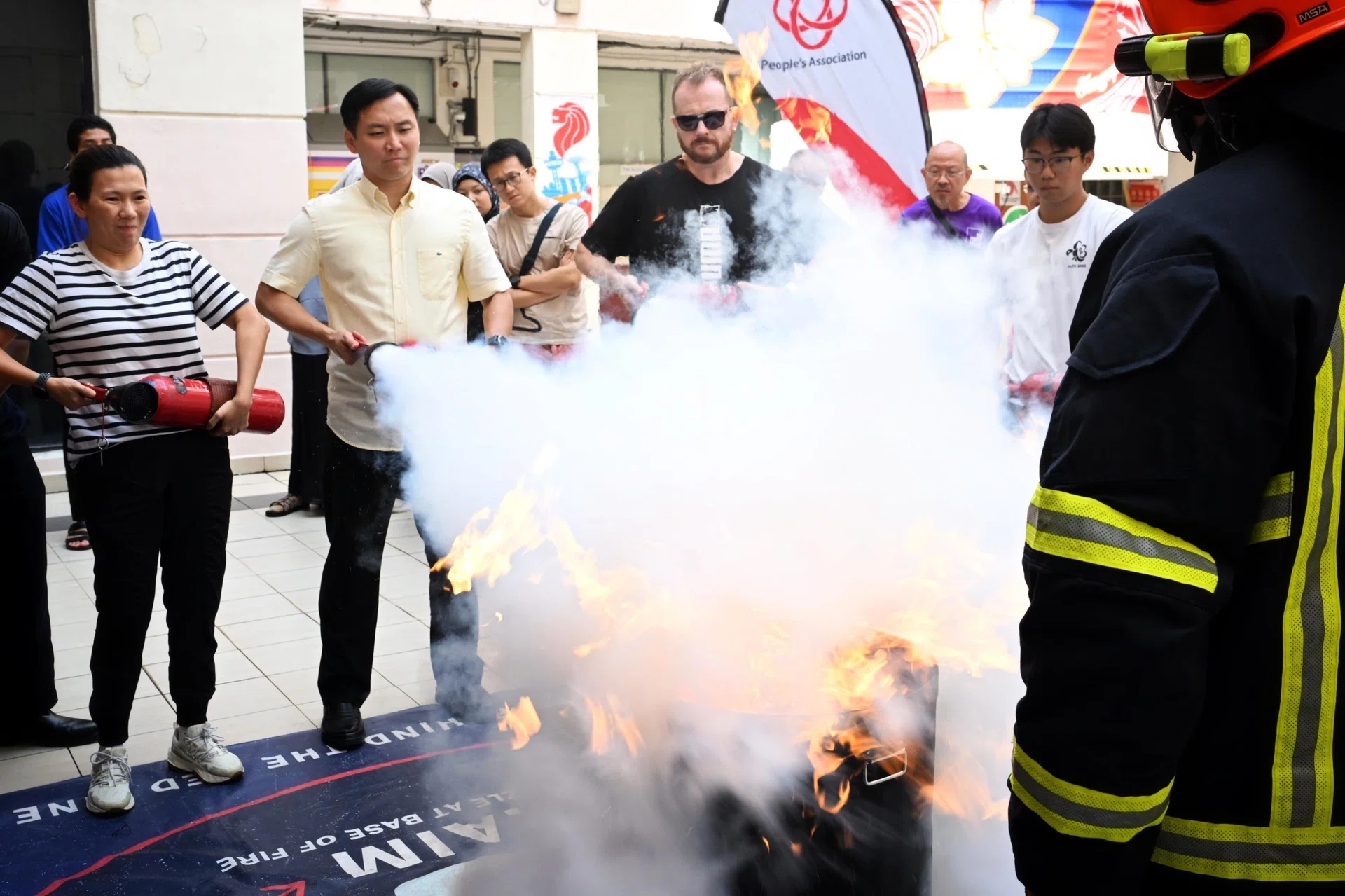 Minister of State for Home Affairs and for Social and Family Development Goh Pei Ming (second from left) joining residents at a Responder Plus Programme at Joo Chiat Community Club on Aug 30.