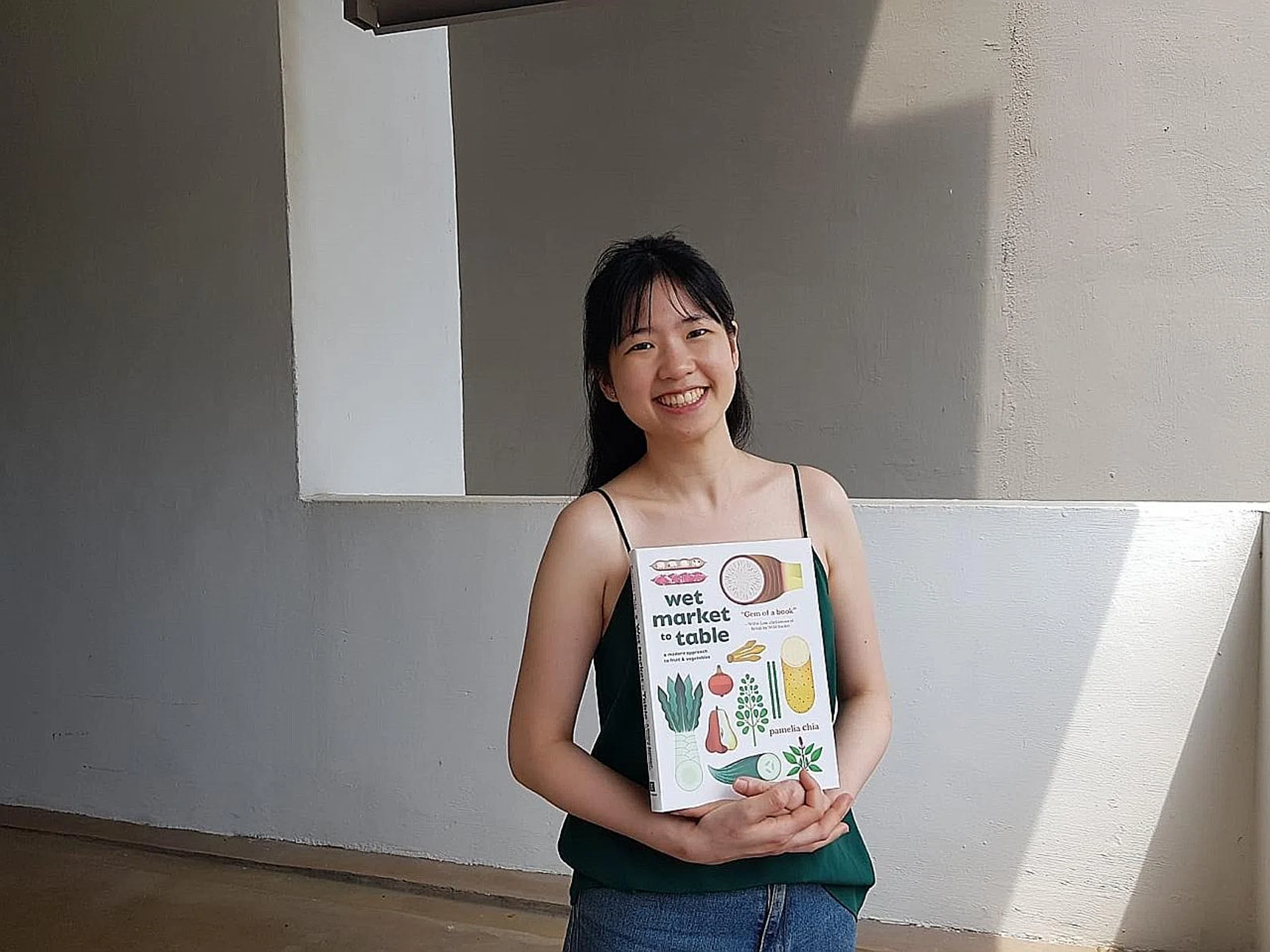 (Above) Ms Pamelia Chia with her book. 