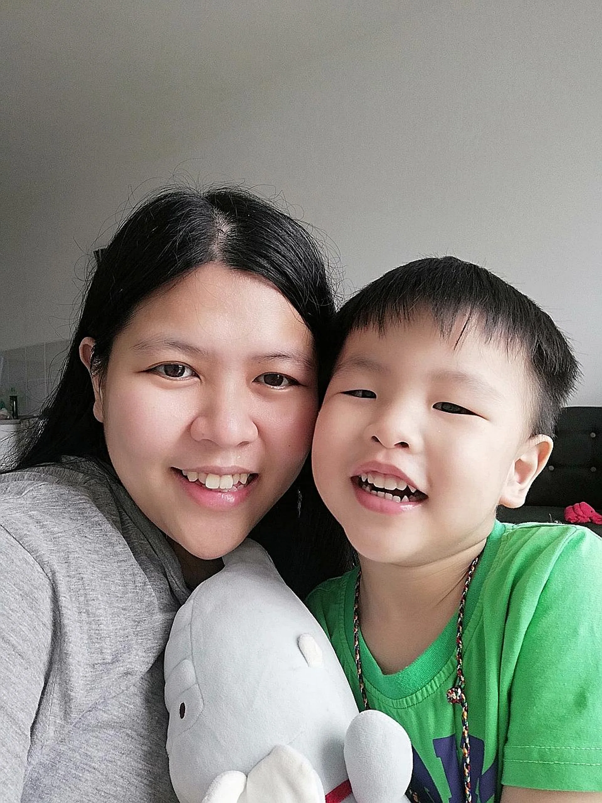 Childcare teacher Jessie New and her son Jackson returned to Johor last month. Her husband is still here as he risks losing his job if he leaves. 