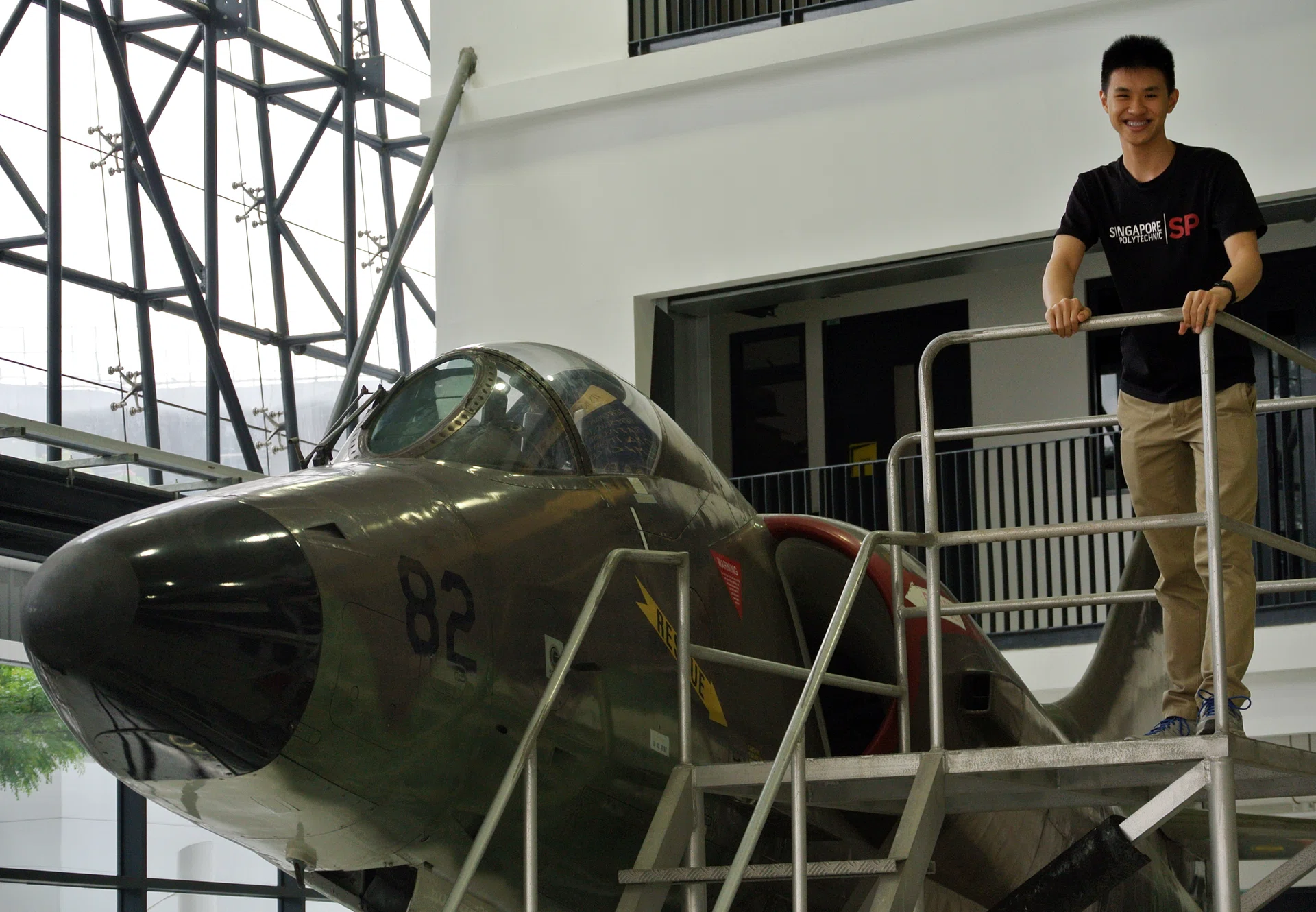 TOP GUN: Mr Lionel Lee, with an A4SU Super Skyhawk in Singapore Polytechnic's Aero Hub, is passionate about mathematics. 