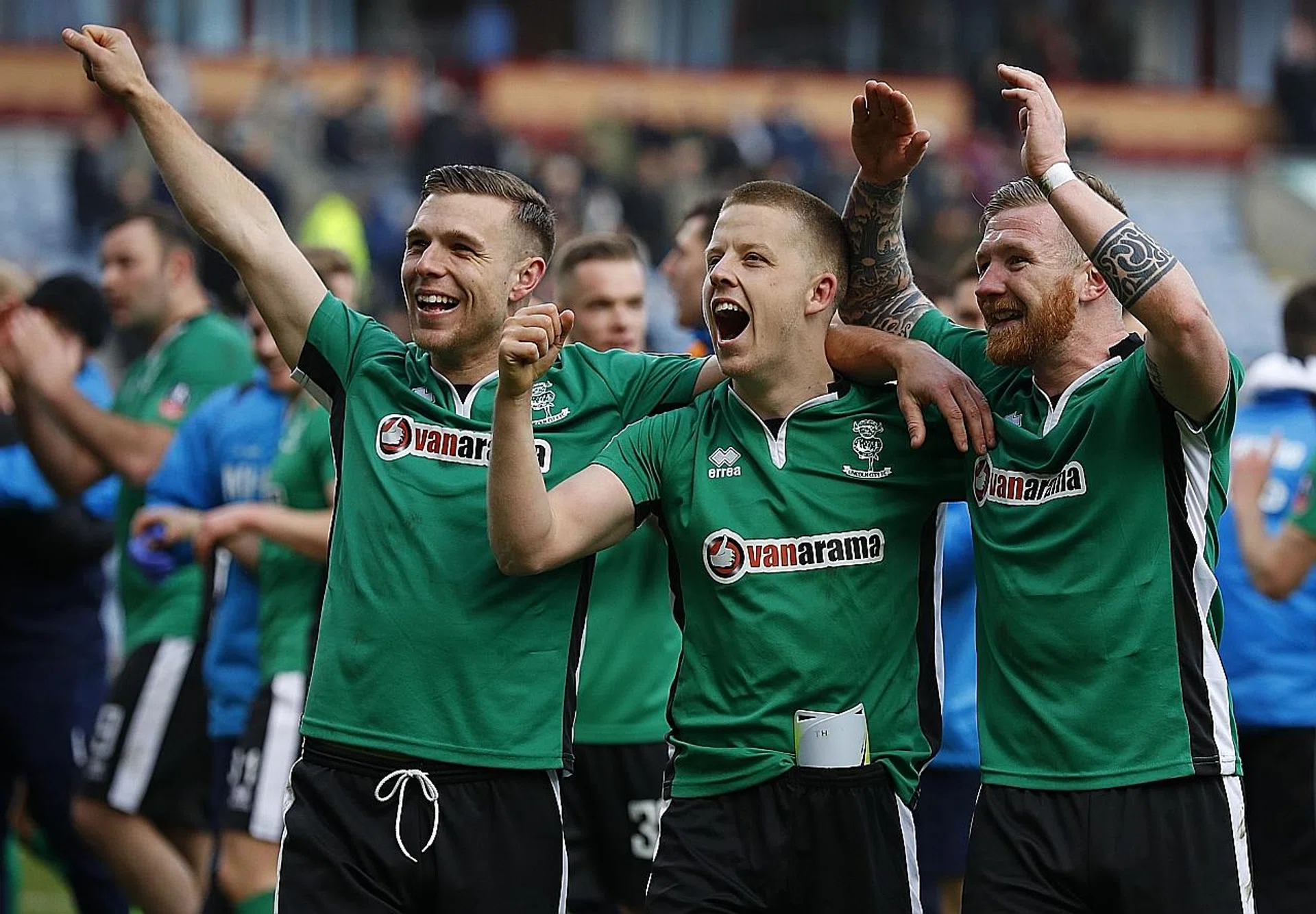 Lincoln City players celebrating after knocking Premiership side Burnley out of the FA Cup in the previous round.