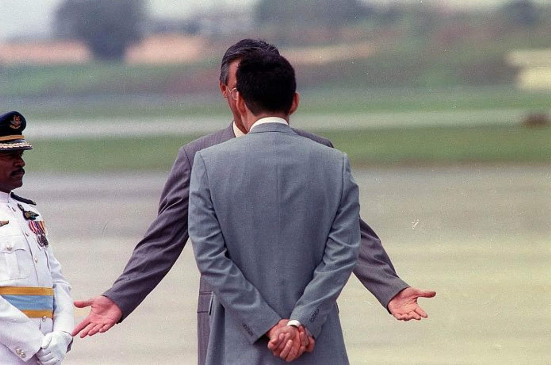 MEMORABLE: Then Prime Minister Goh Chok Tong (arms out) with then Deputy Prime Minister Lee Hsien Loong, at the airport to welcome the Sultan of Brunei in 1992.