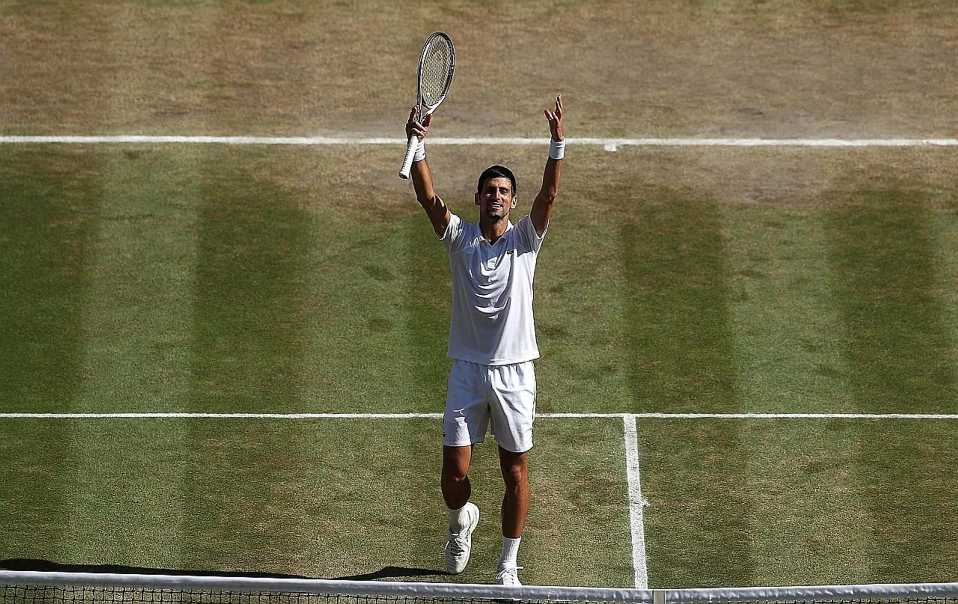 The barren patch around the baseline behind Wimbledon champion Novak Djokovic suggests that the serve-and-volley game is no longer in fashion. 