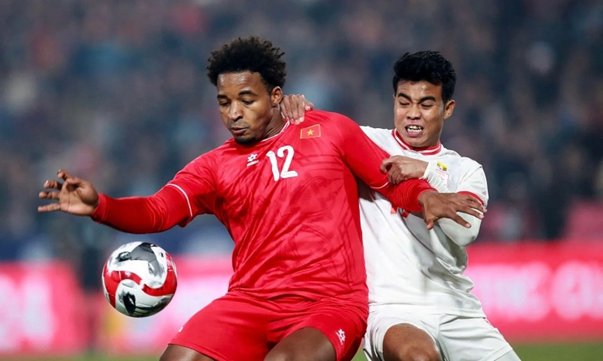 Vietnam's Nguyen Xuan Son (left) controls the ball during their 5-0 win over Myanmar in an Asean Championship Group B match.