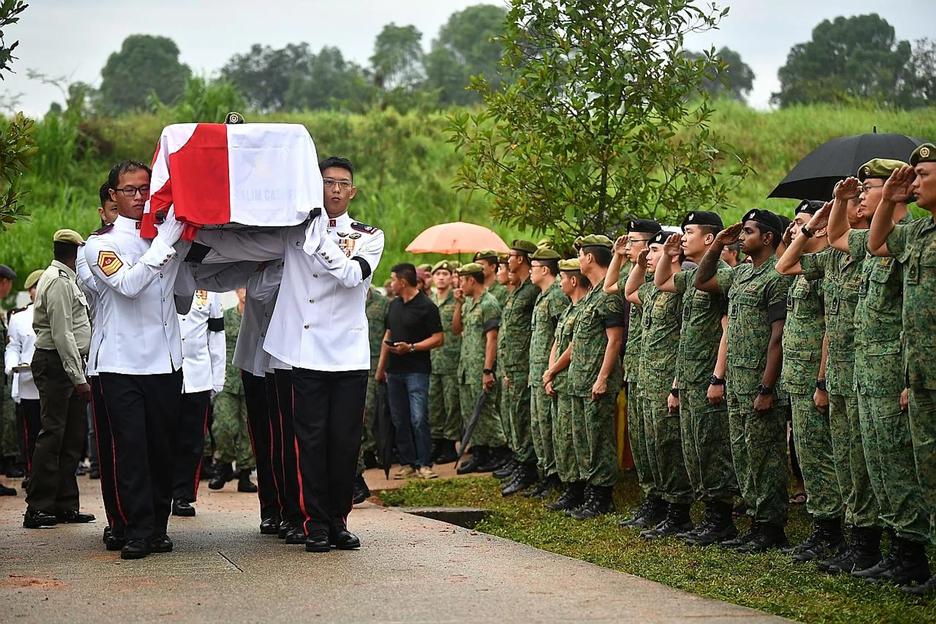 SAF personnel saluting the coffin during the funeral of 3WO Muhammad Sadikin Hasban.  