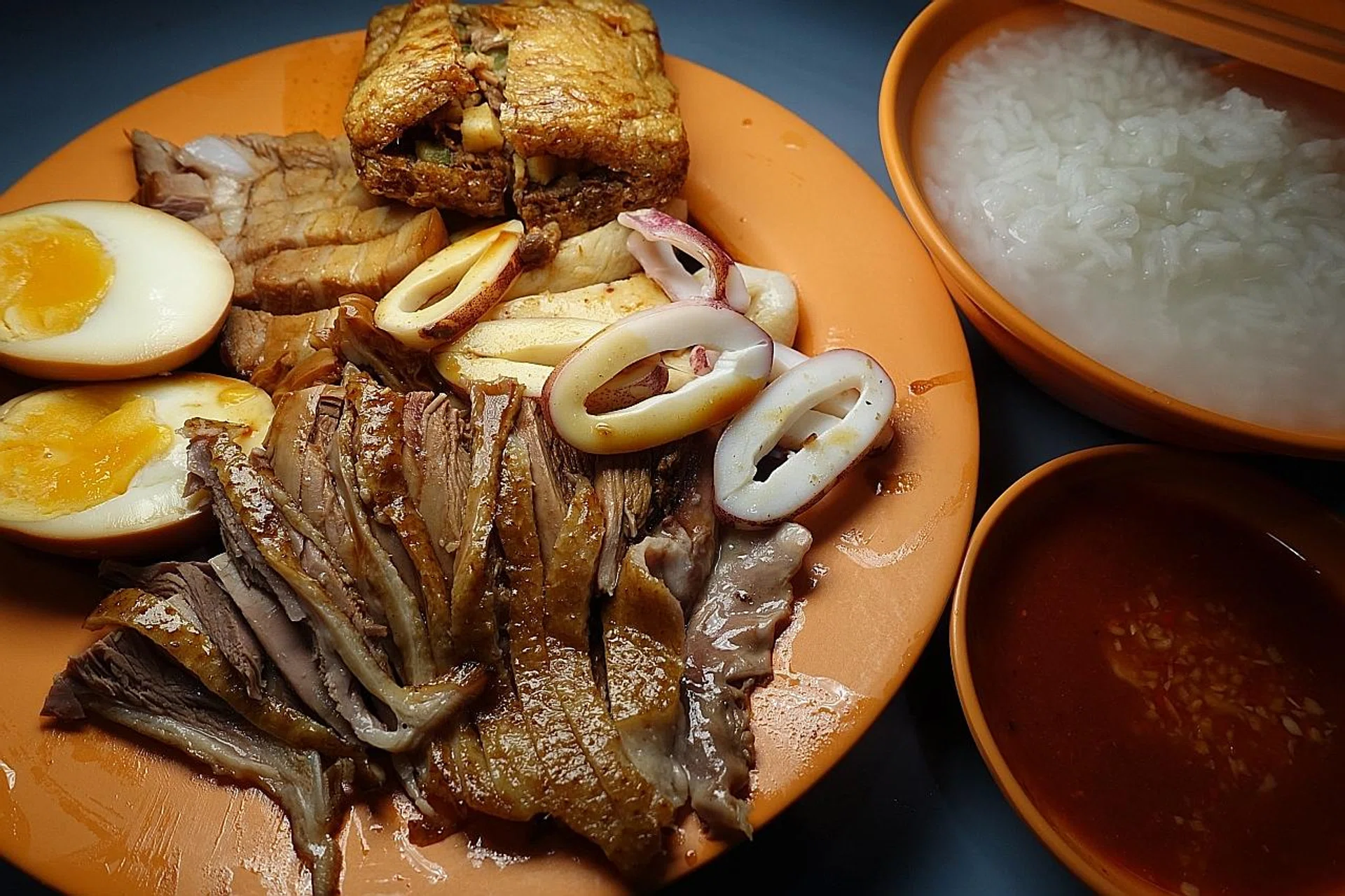 A platter of pork belly, sotong, tau pok, intestines, egg, duck and fish cake.