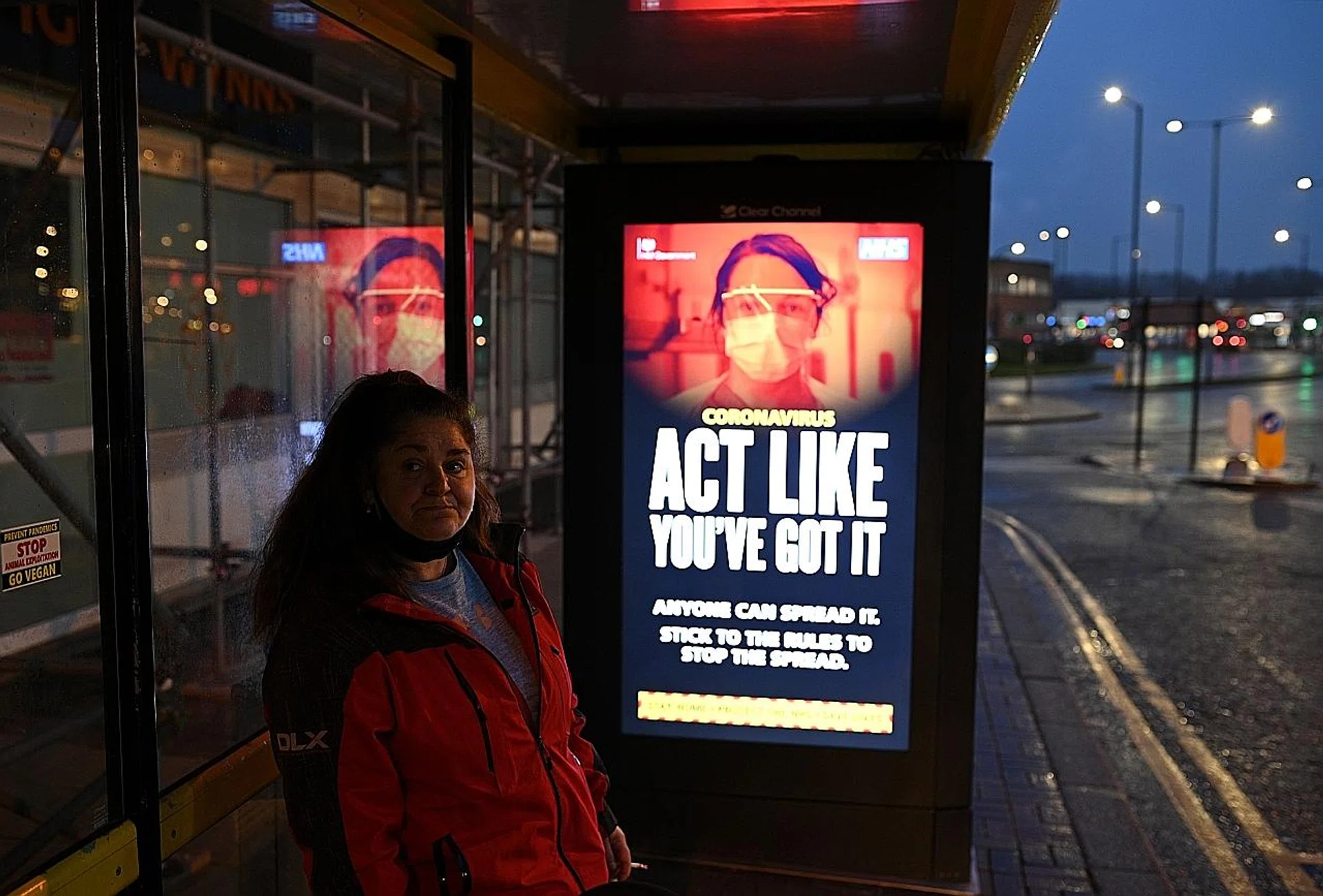 A Covid-19 information sign at a bus stop in England which reads "Act like you've got it". Britain's death toll at 91,470 is Europe's worst figure and the world's fifth worst after the US, Brazil, India and Mexico. 