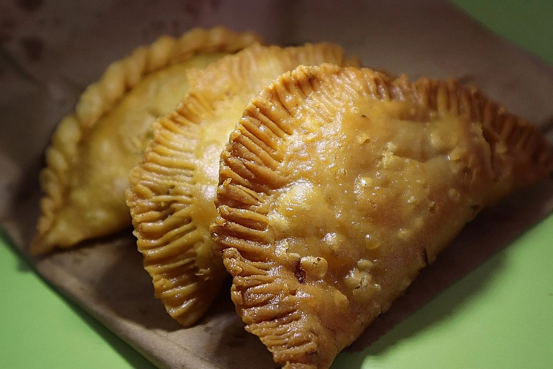 Two crispy sardine epok epok with a potato version at the back. 